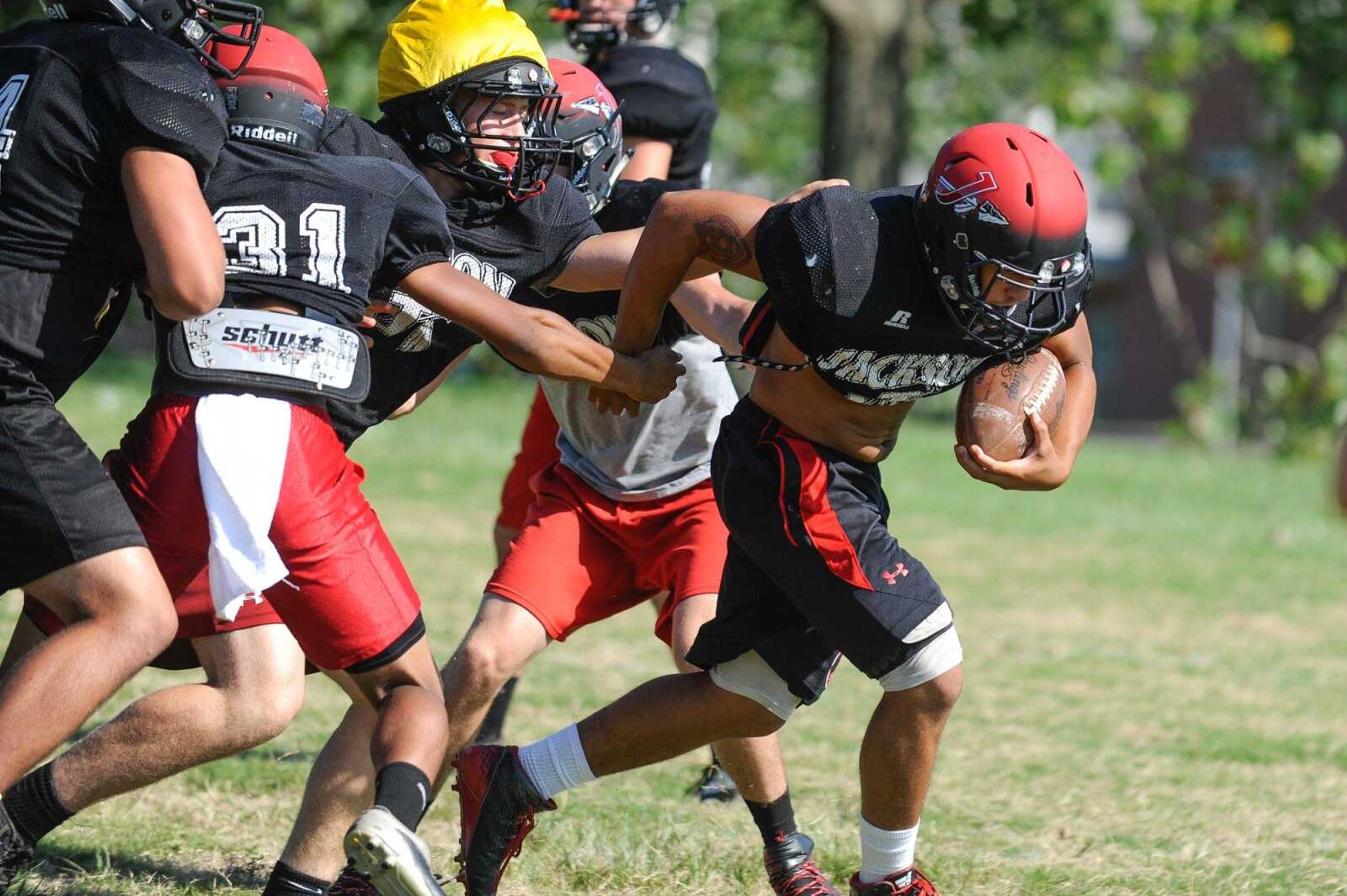 Jackson's Brydan Reid breaks free on a run during a drill in practice Tuesday, Aug. 11, 2015 at Jackson High School. (Glenn Landberg)