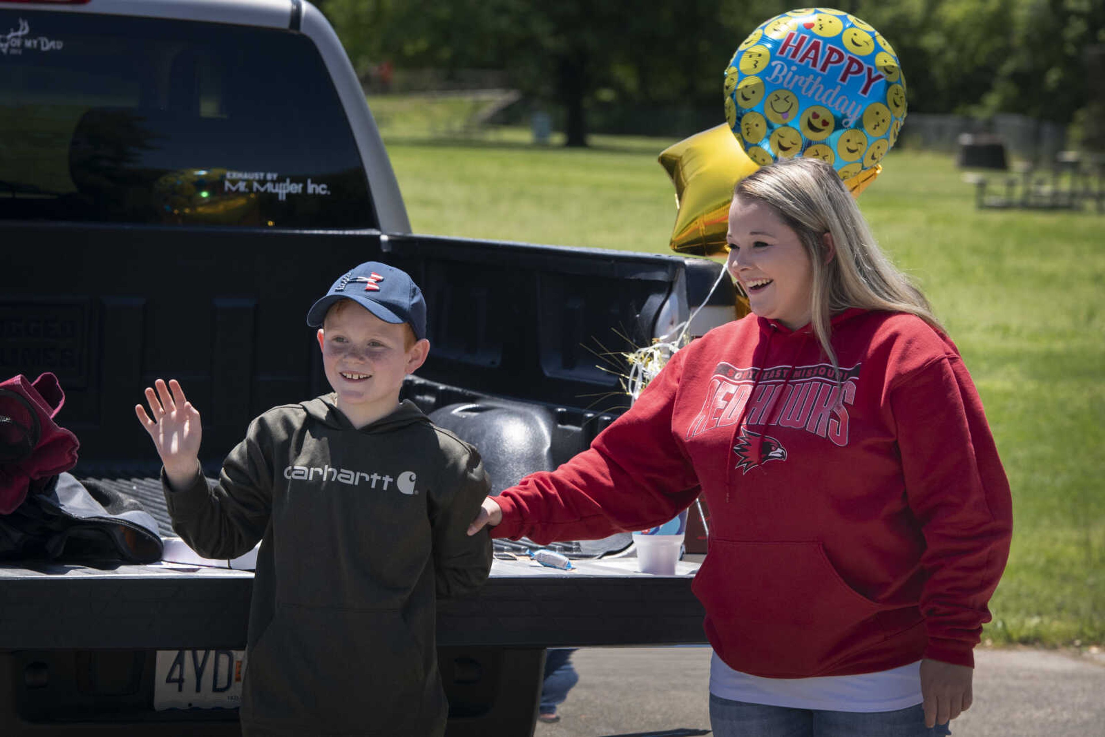 Collin Stephens of Cape Girardeau and his mother Michaela Stephens smile during Collin's surprise-birthday parade Saturday, May 9, 2020, at Shawnee Park in Cape Girardeau. Collin turns 10 on Sunday.