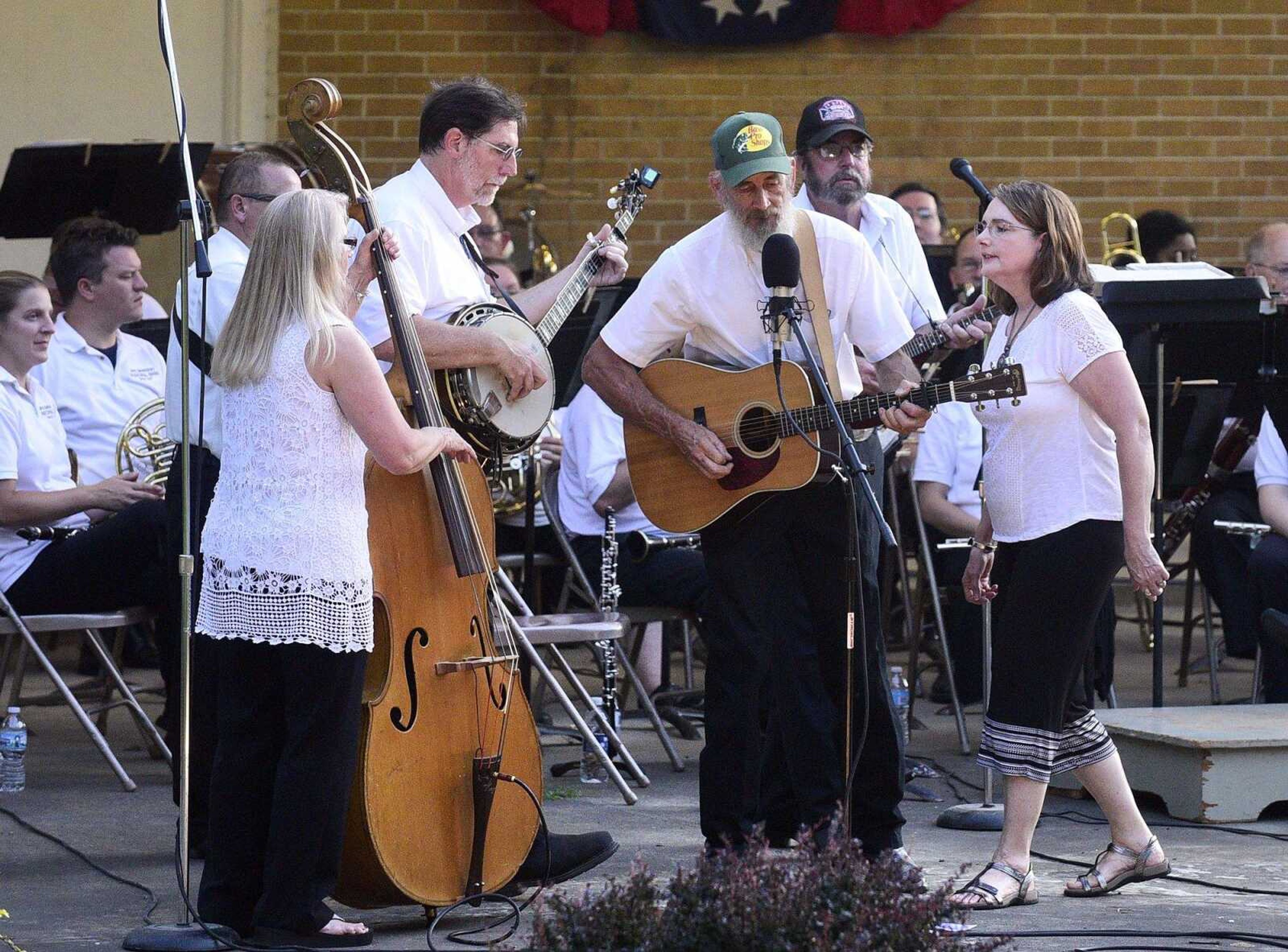 Janie Brown and the Chestnut Mountain Gang performs before the start of the Cape Girardeau Municipal Band's performance July 12 in Capaha Park.