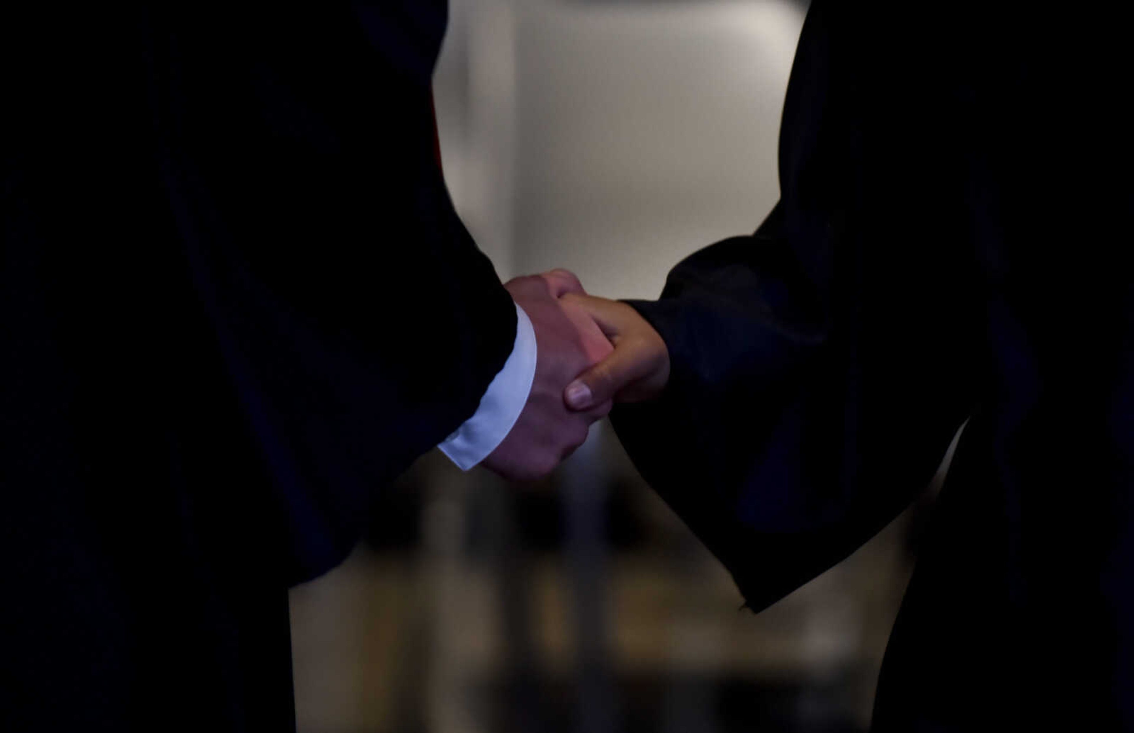 Graduates shake hands after receiving diplomas during the Cape Central High School Class of 2018 graduation Sunday, May 13, 2018 at the Show Me Center in Cape Girardeau.