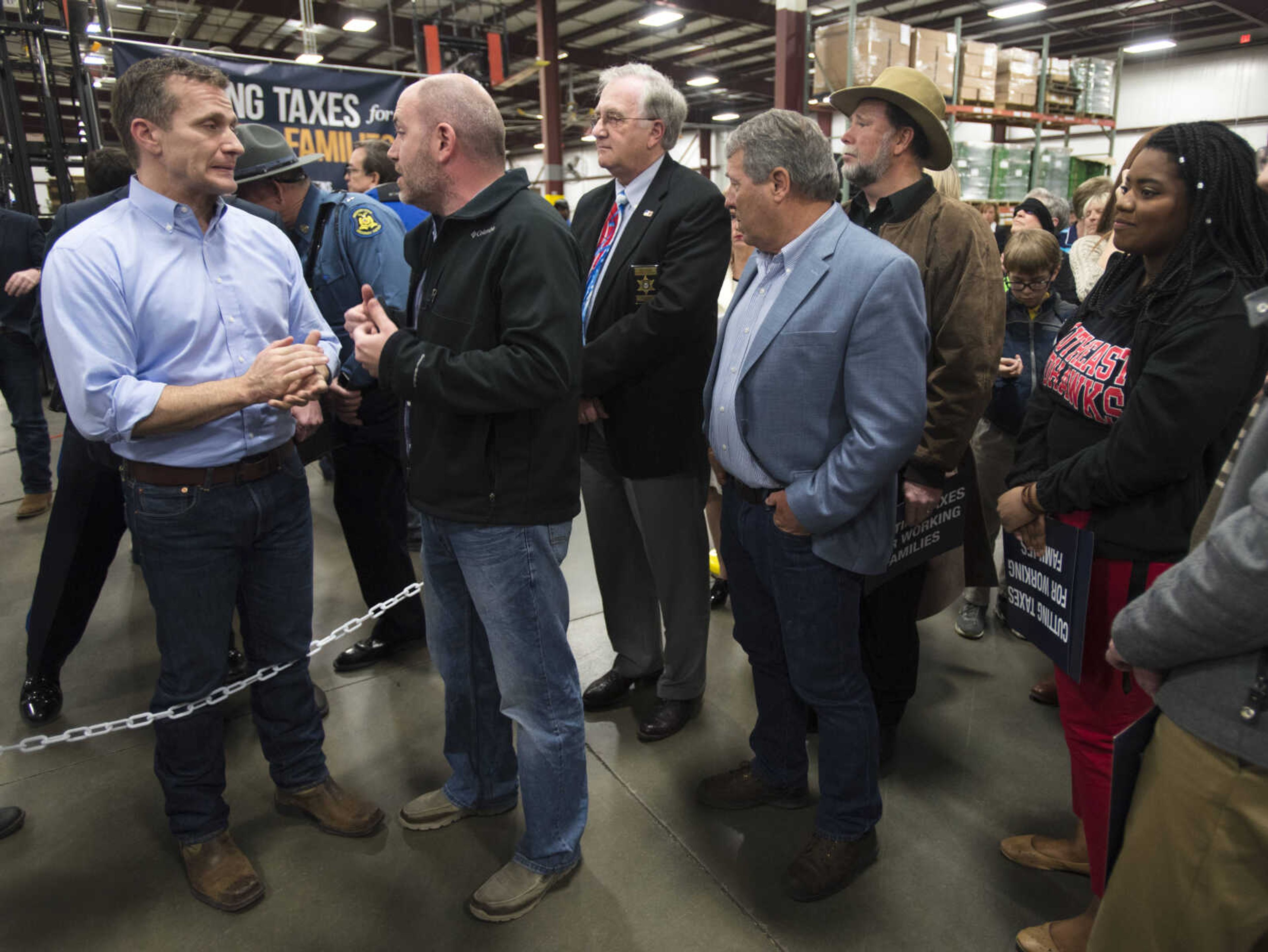 Governor Eric Greitens talks with a member of the community about higher education Jan. 29, 2018, after speaking at Signature Packaging and Paper in Jackson to discuss tax cuts.