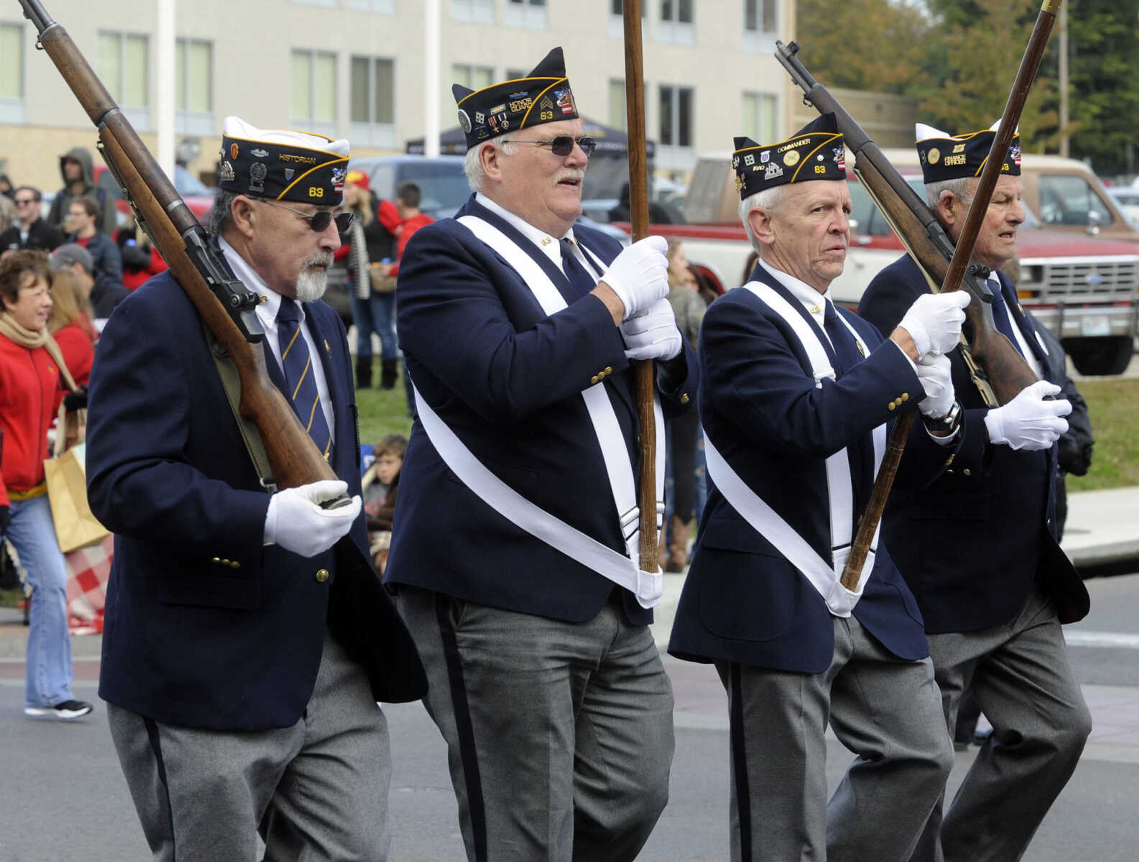 The VFW Post 63 honor guard marches in the SEMO Homecoming parade Saturday, Oct. 26, 2013 on Broadway in Cape Girardeau.