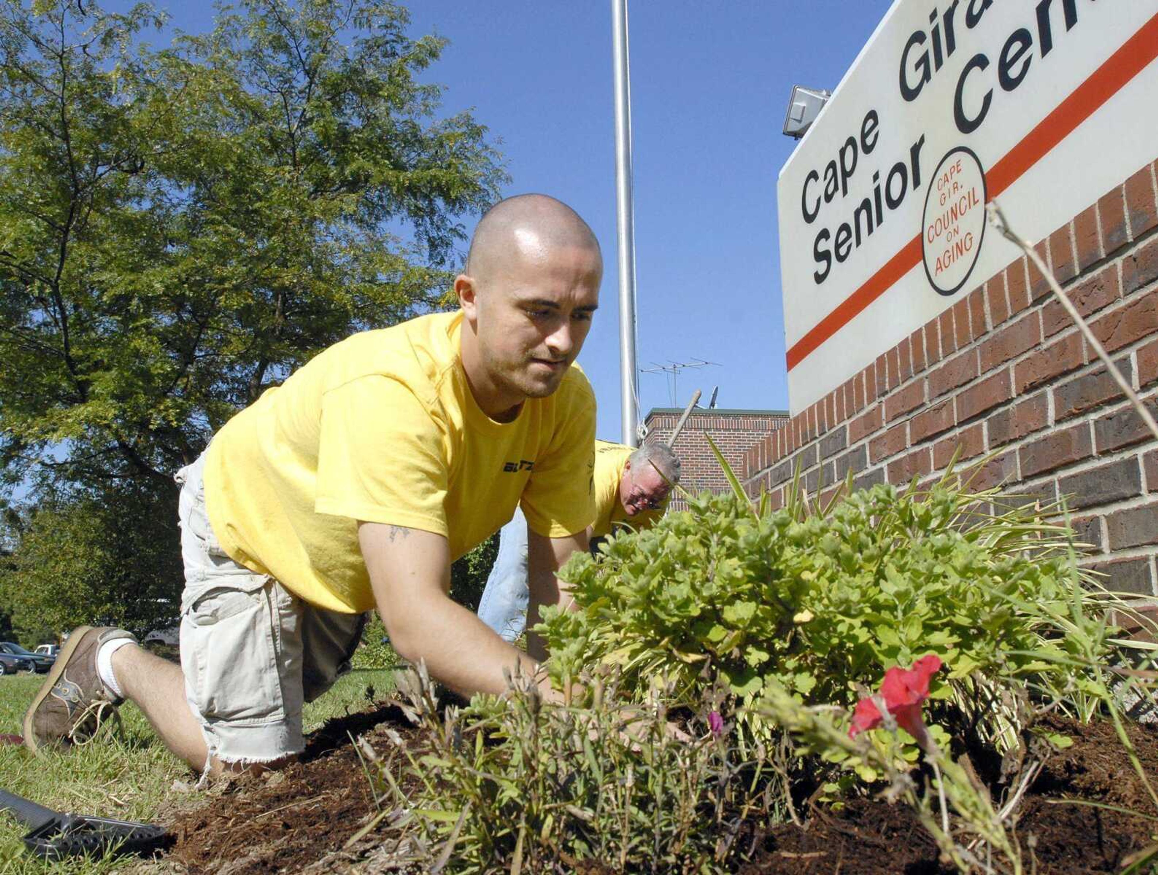 FRED LYNCH ~ flynch@semissourian.com
Justin Brown and Joe Bishop spruce up the landscaping at the Cape Girardeau Senior Center with volunteers from LaCroix Church during the service blitz Saturday.