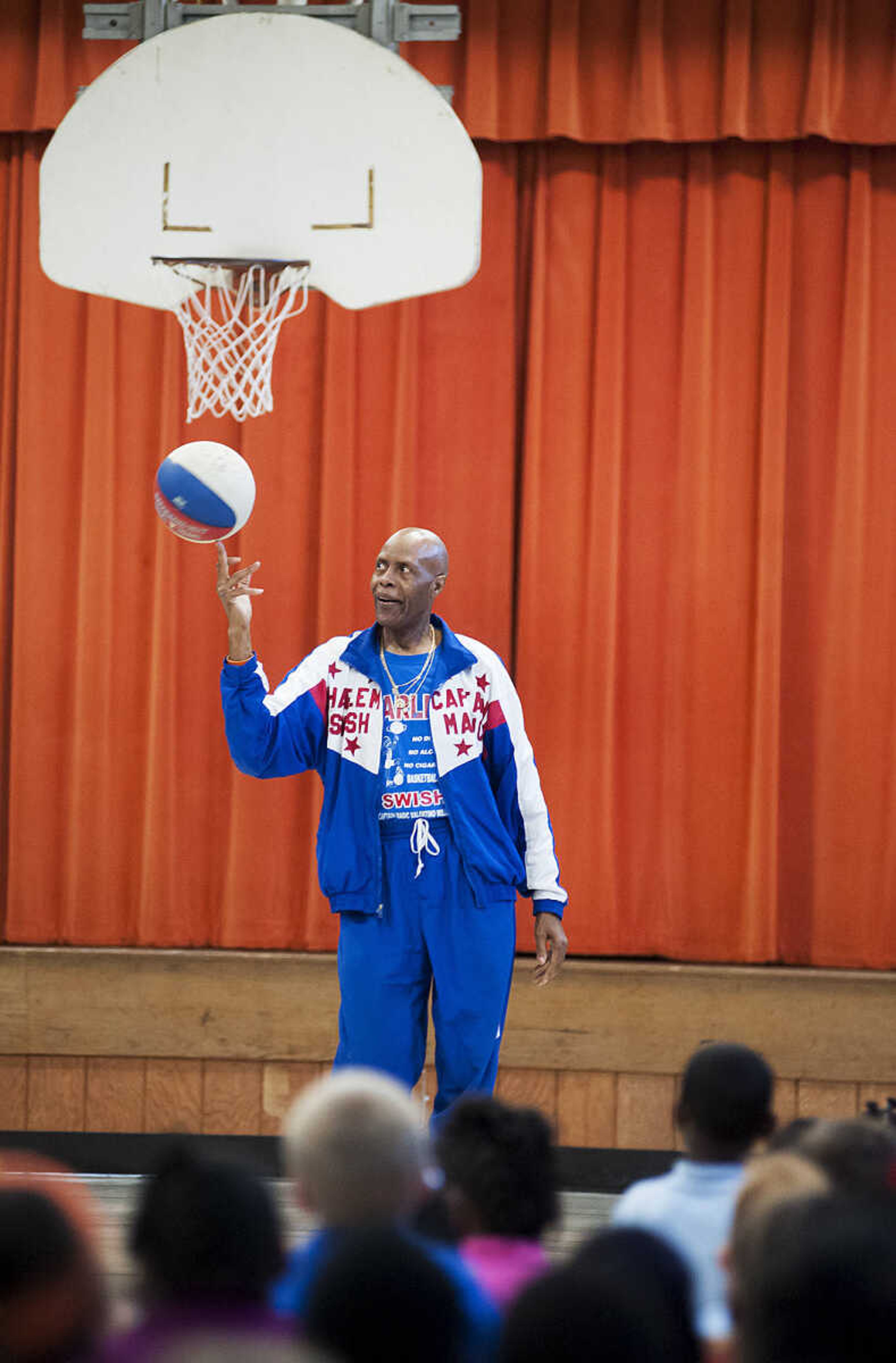 Captain "Magic" Valentino Willis talks with the students at Jefferson Elementary School Tuesday, Sept. 24, in Cape Girardeau. Willis, who is with the Harlem Swish Comedic Basketball Team, used his basketball and comedy skills to encourage the students to not smoke, drink or do drugs while respecting their teachers, principals, coaches and each other.