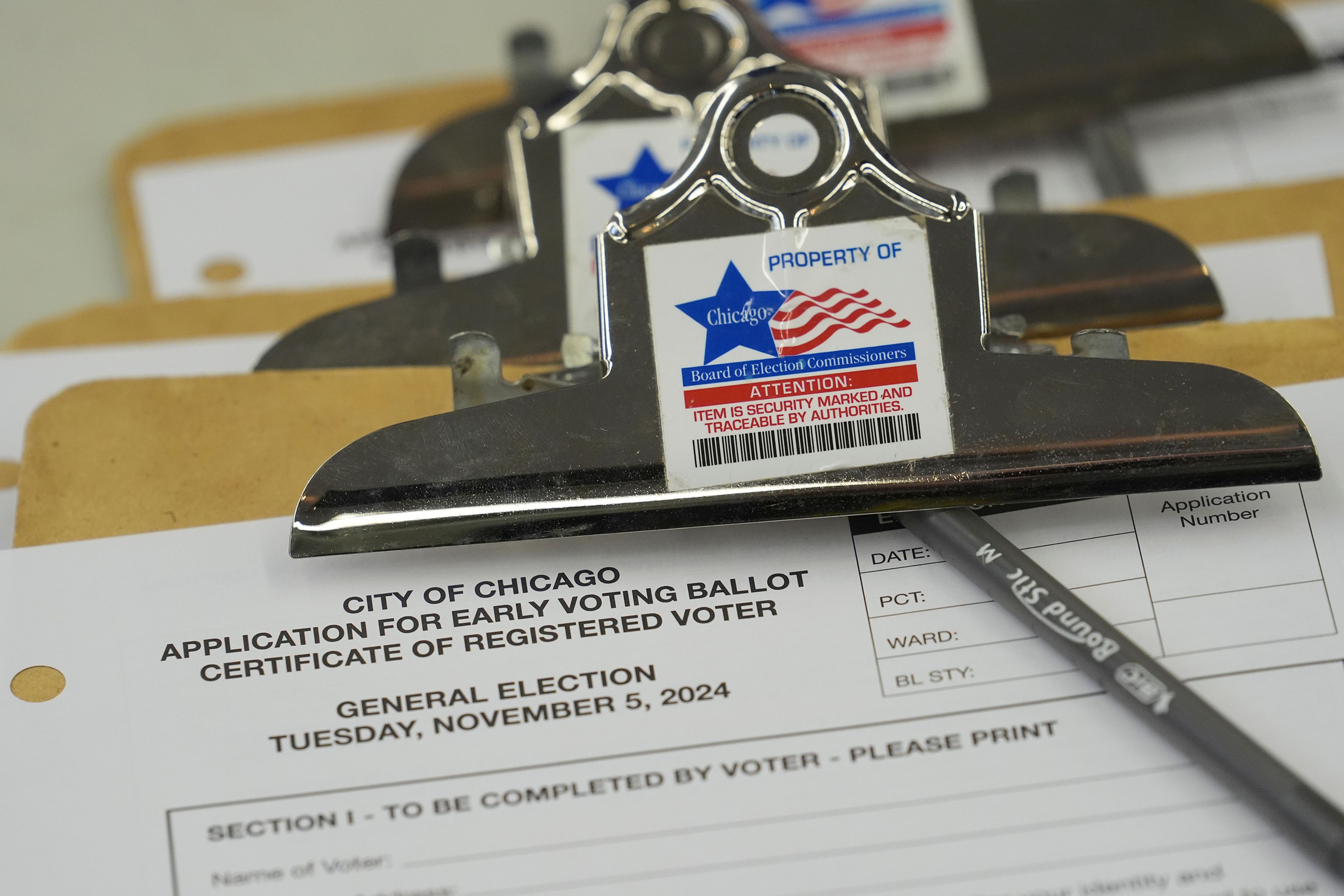 An application for early voting is on display during the first day of early voting for the 2024 Presidential General Election, Thursday, Oct. 3, 2024 in Chicago. (AP Photo/Charles Rex Arbogast)