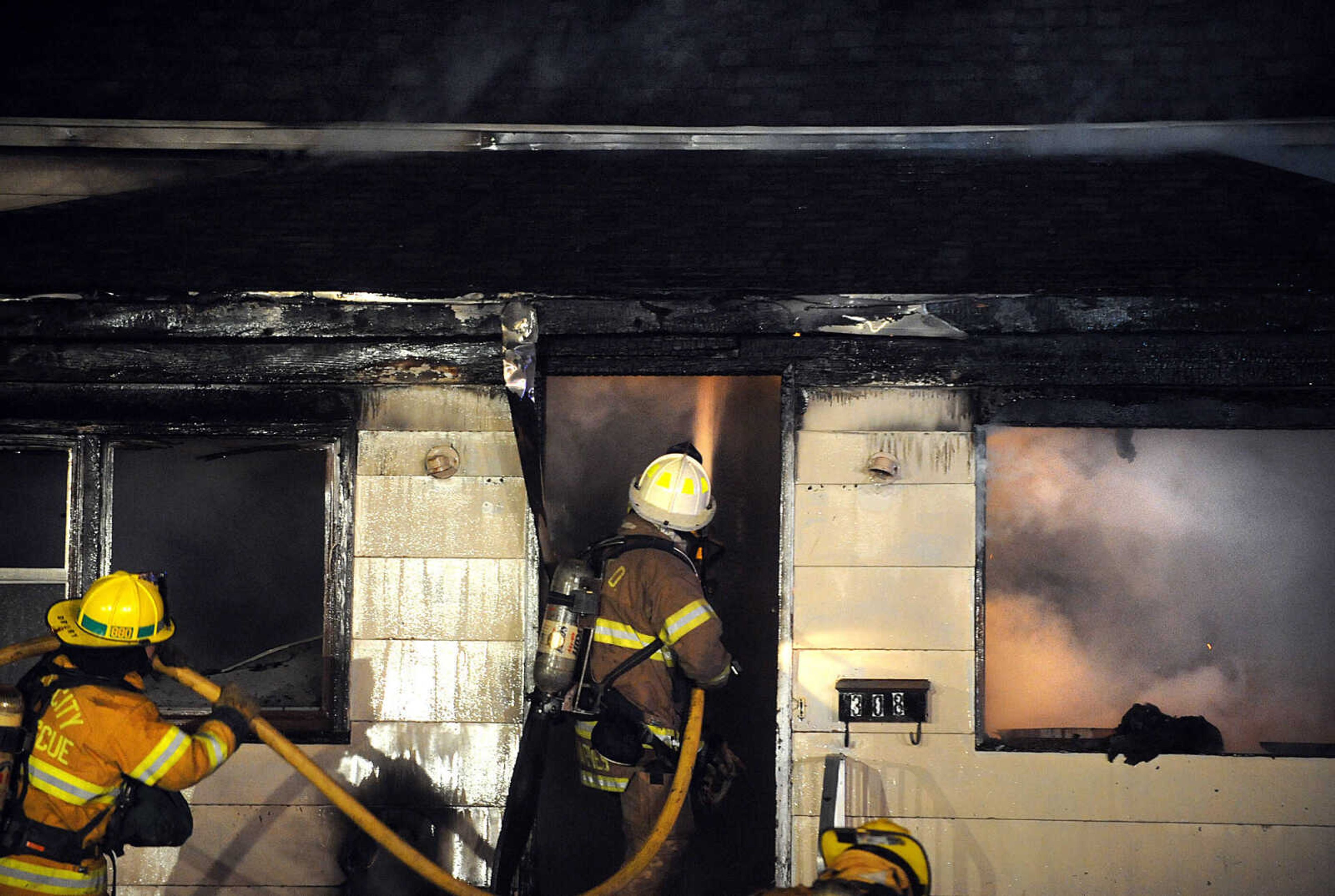 LAURA SIMON ~ lsimon@semissourian.com

Members of the Scott City and Cape Girardeau fire departments battle a blaze at 308 W. Missouri Blvd. in Scott City, Wednesday, Dec. 18, 2013. Nobody was injured in the fire.