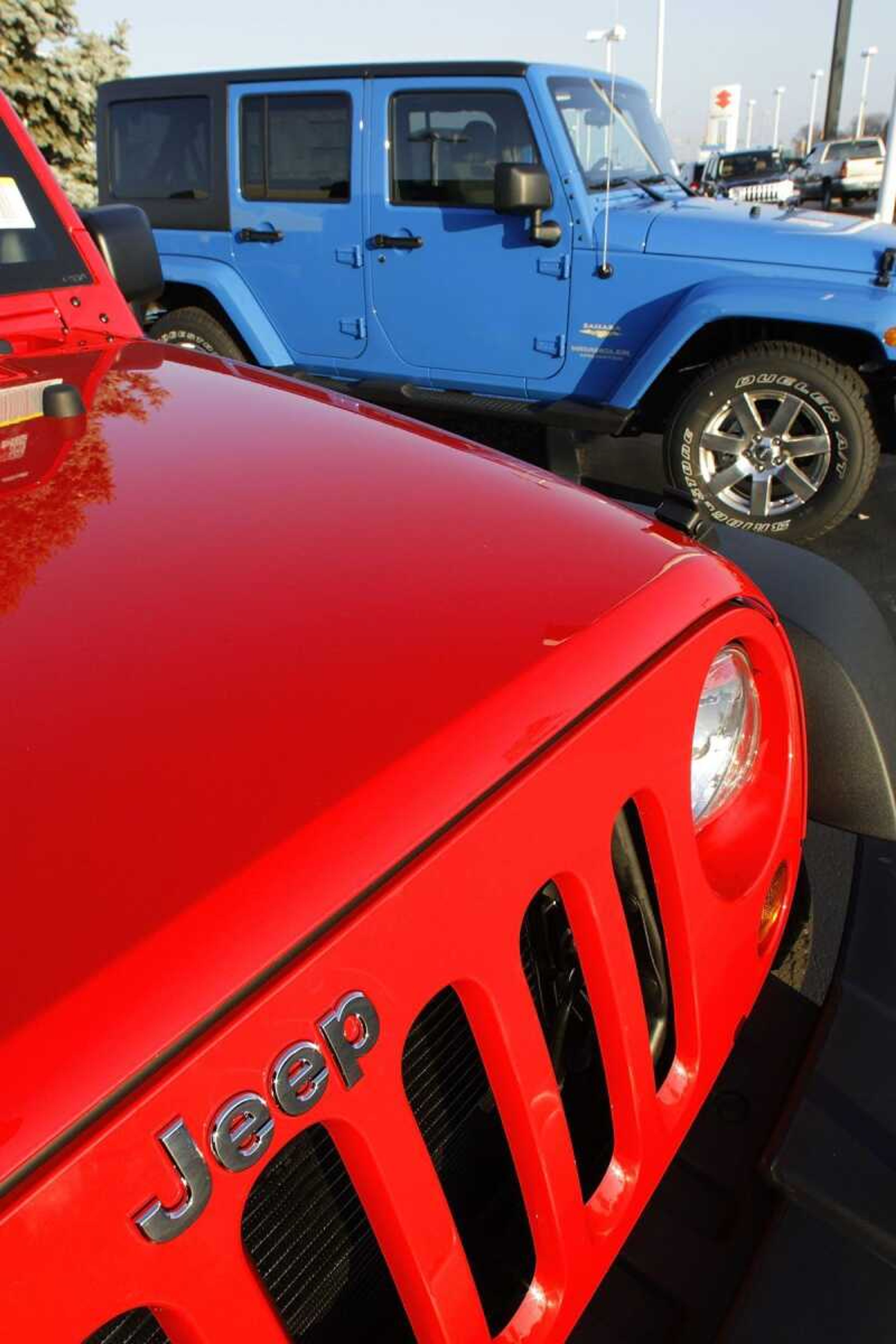 2012 Jeep Wranglers shown Dec. 11 for sale at an auto dealership in Springfield, Ill. (Associated Press file)