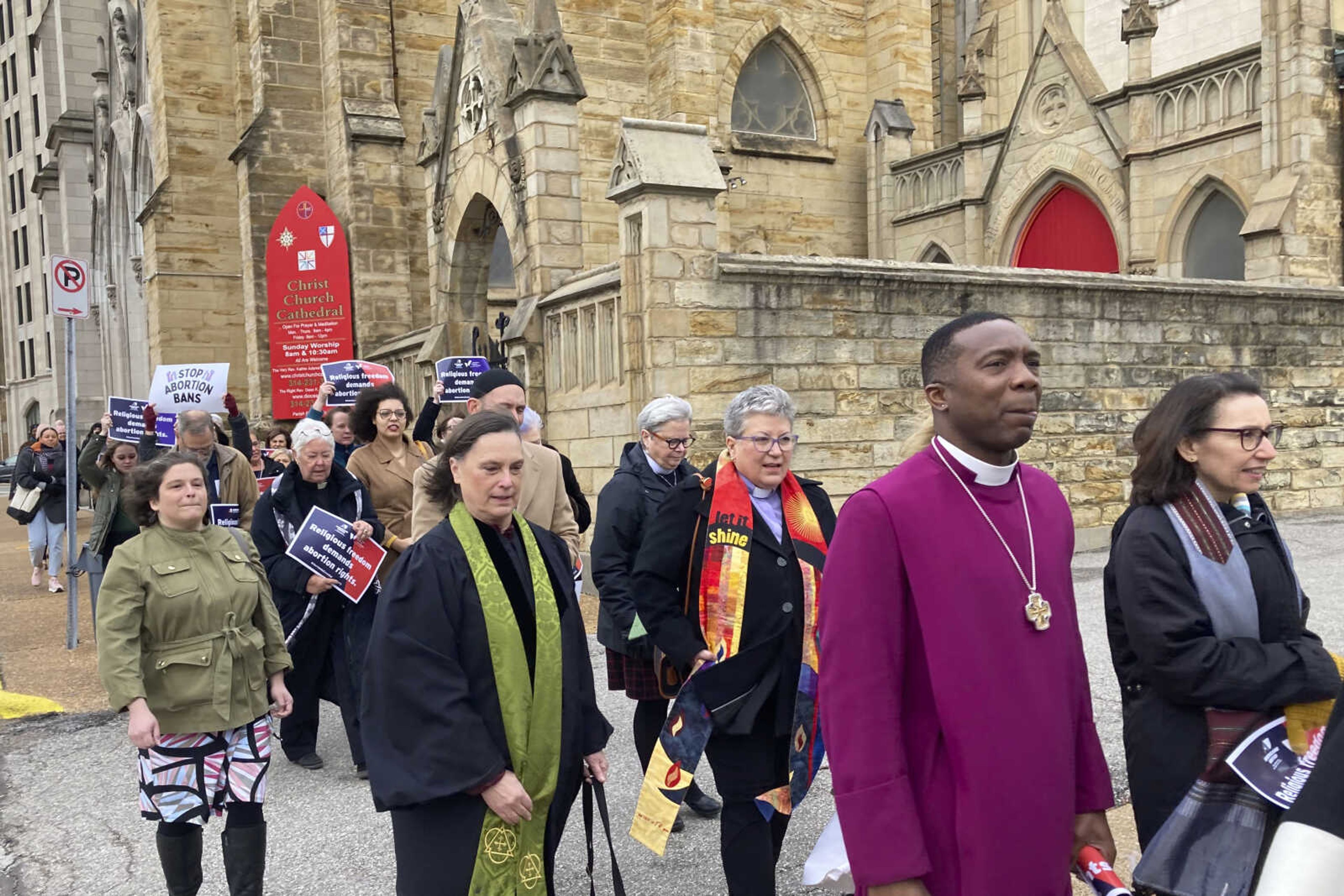 FILE - Clergy who filed suit seeking to overturn Missouri's abortion law and other opponents of the law hold a March through downtown St. Louis on Thursday, Jan. 19, 2023. A St. Louis judge on Thursday, Nov. 16, 2023 will hear arguments in a lawsuit challenging Missouri's abortion ban on the grounds that lawmakers who passed the measure imposed their own religious beliefs on others who don t share them. The lawsuit was filed in January on behalf of 13 Christian, Jewish and Unitarian Universalist leaders who support abortion rights. (AP Photo/Jim Salter, File)