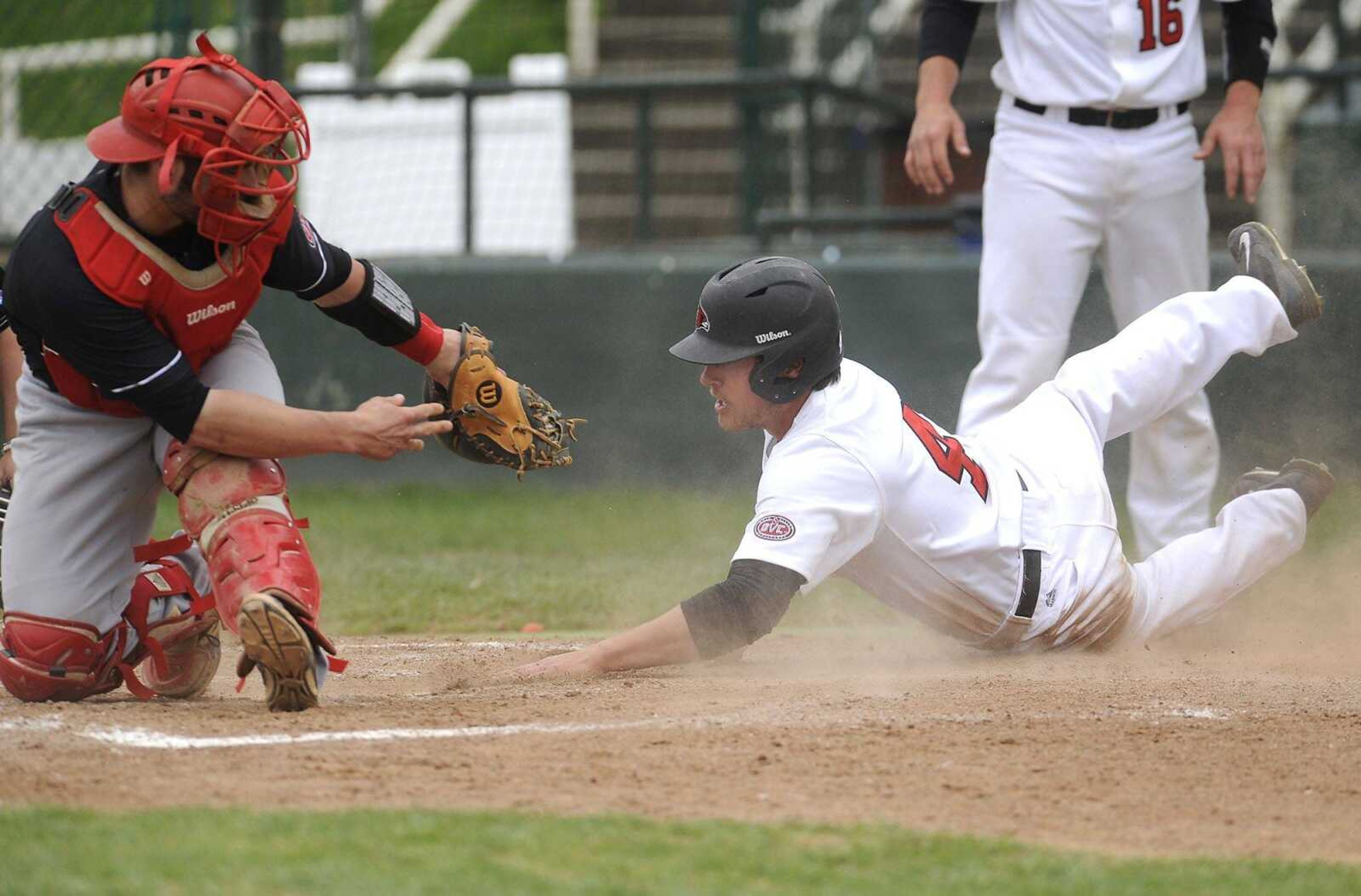 Southeast Missouri State's Clayton Evans touches home plate to score against Austin Peay catcher T.J. Marik on a triple by Trevor Ezell during the fifth inning Sunday, April 5, 2015 at Capaha Field. (Fred Lynch)