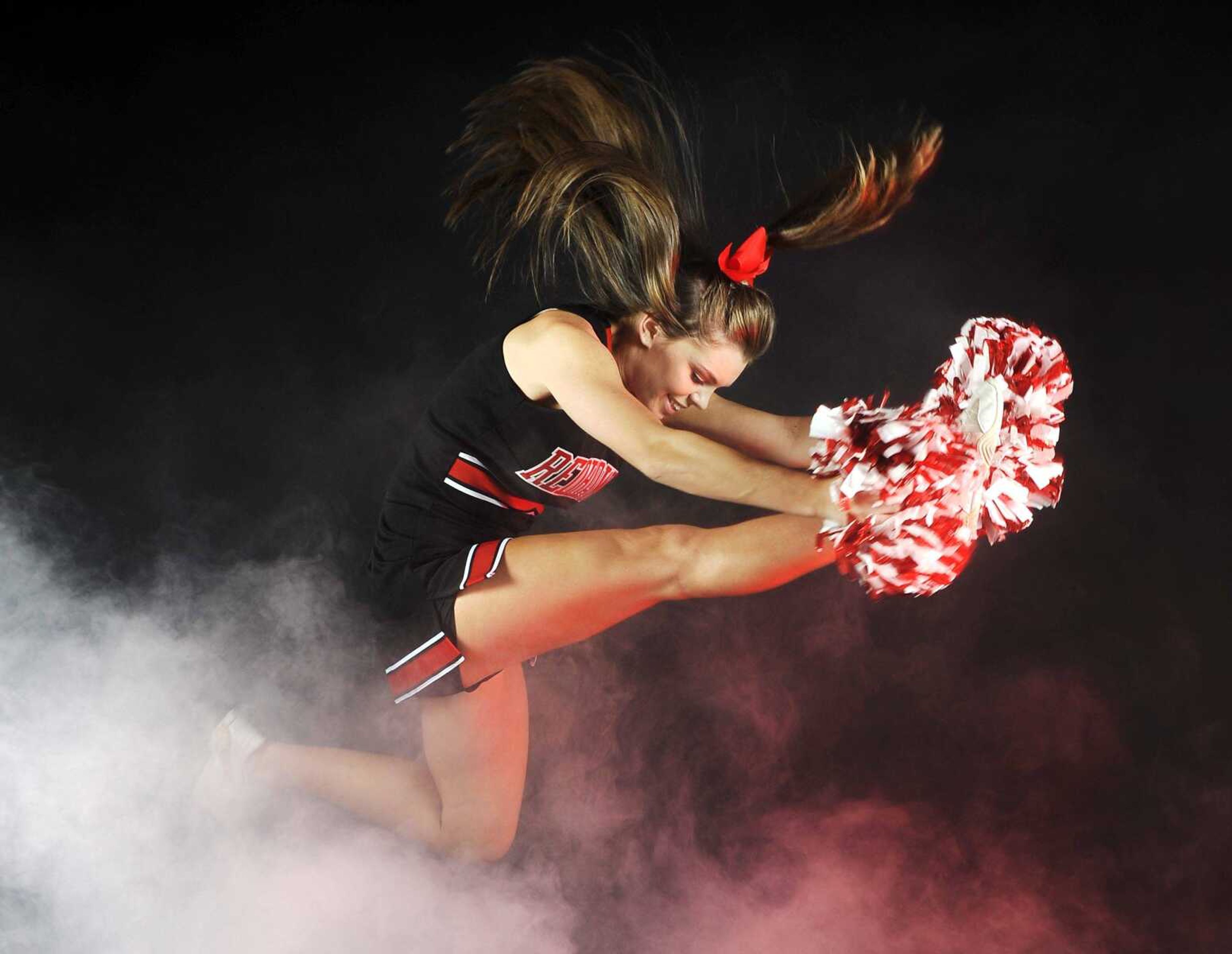 Closer look: Cheerleaders work hard to entertain, excite crowd