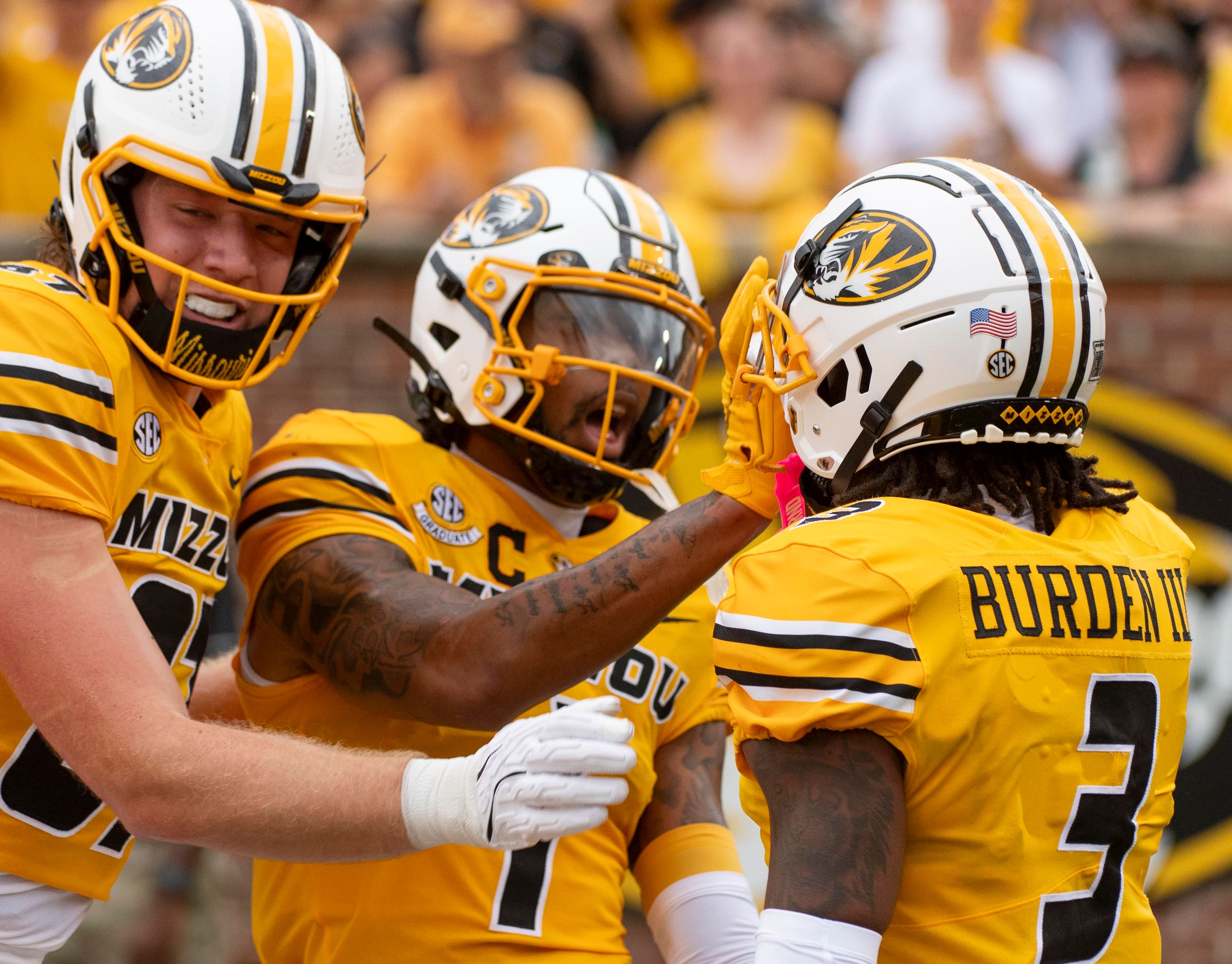 Missouri wide receiver Luther Burden III (3) celebrates after his touchdown with teammates Brett Norfleet, left, and Theo Wease Jr., center, during the first quarter of an NCAA college football game against Vanderbilt, Saturday, Sept. 21, 2024, in Columbia, Mo. (AP Photo/L.G. Patterson)