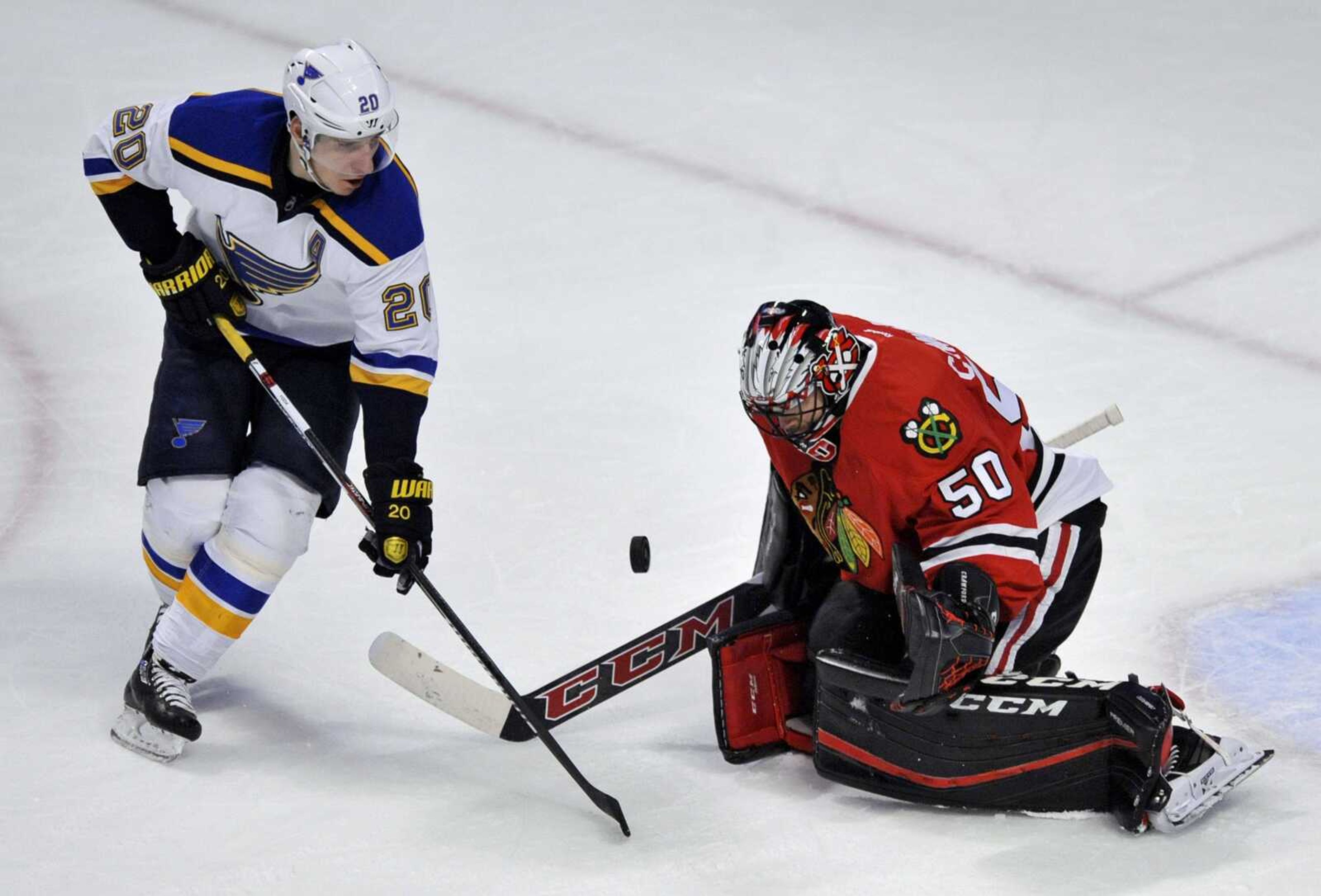 Blackhawks goalie Corey Crawford makes a save against the Blues' Alexander Steen during the first period Sunday in Chicago. The Blackhawks won 2-0.