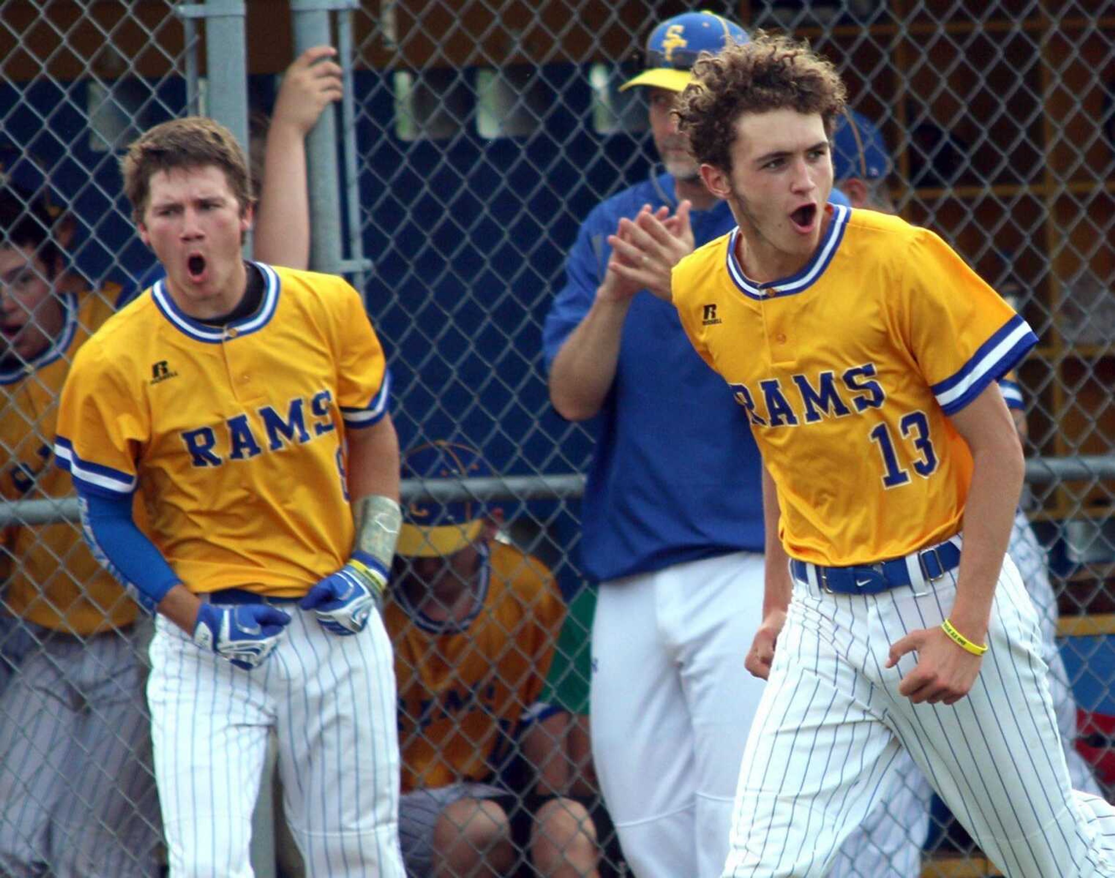 Scott City's Isiah Berry (13) and Caden Hillemann (left) react after a home run by Trent Pobst during their Class 3 sectional game victory last week at Scott City High School.