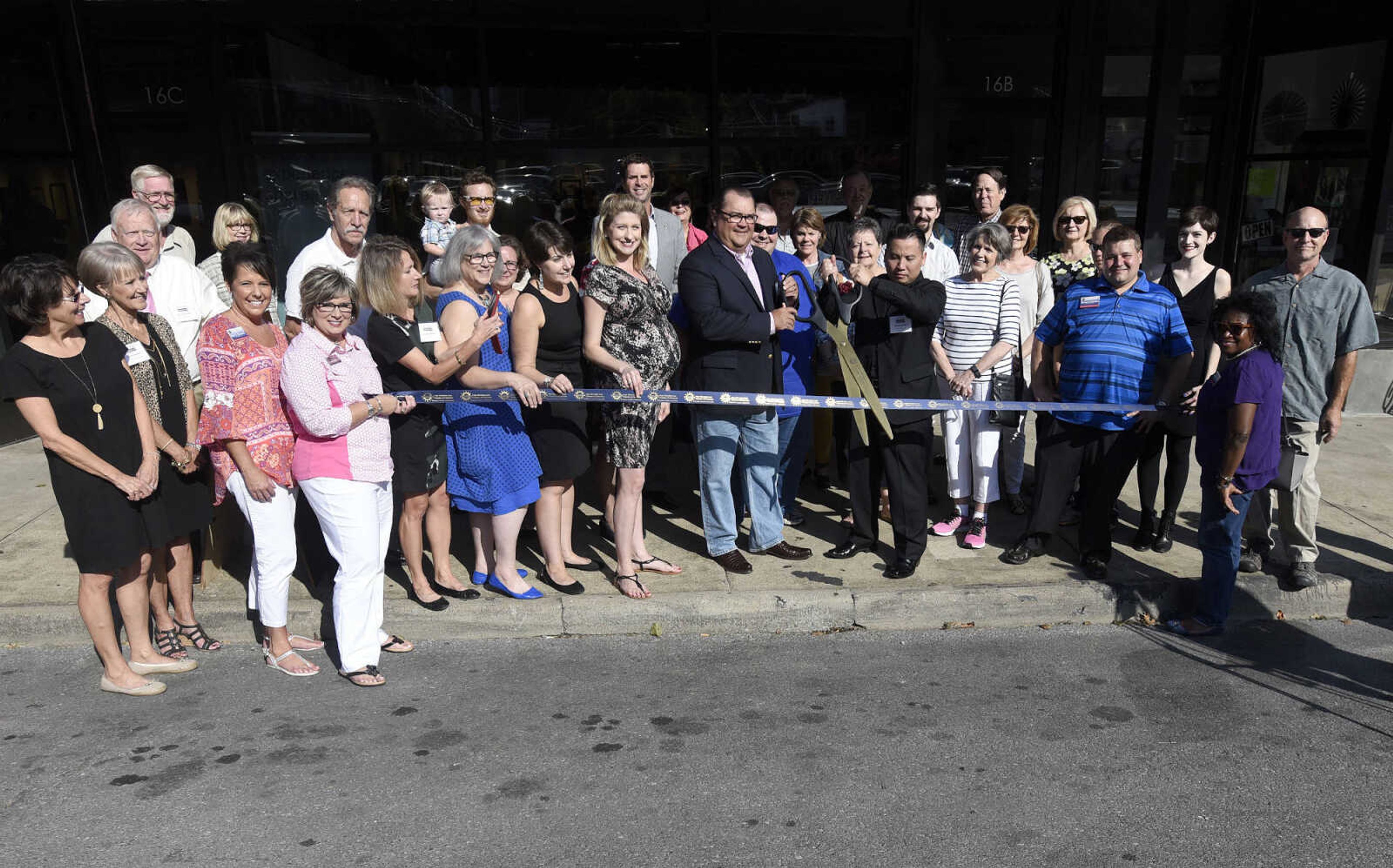 LAURA SIMON ~ lsimon@semissourian.com

The ribbon is cut during the grand opening reception for the 4th annual Members Exhibit at the Arts Council of Southeast Missouri in its new location at 16 North Spanish Street in downtown Cape Girardeau on Friday, Sept. 2, 2016.