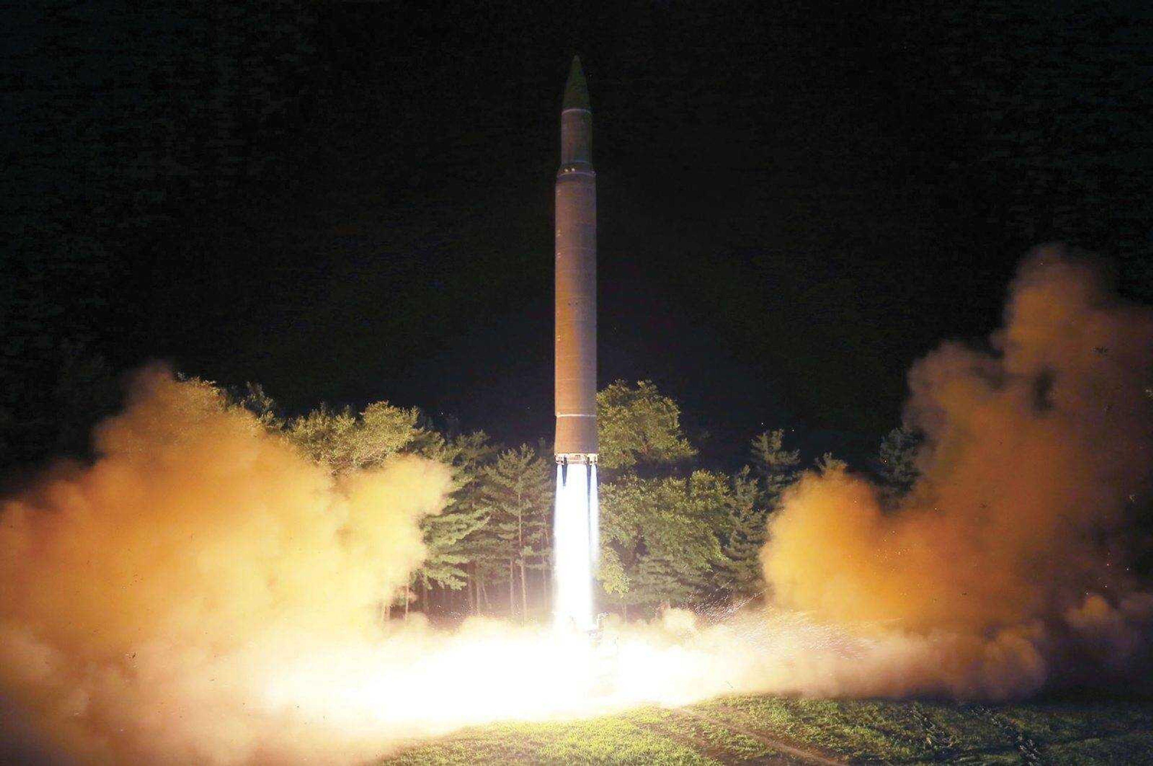 This photo shows what was said to be the launch Friday of a Hwasong-14 intercontinental ballistic missile at an undisclosed location in North Korea.