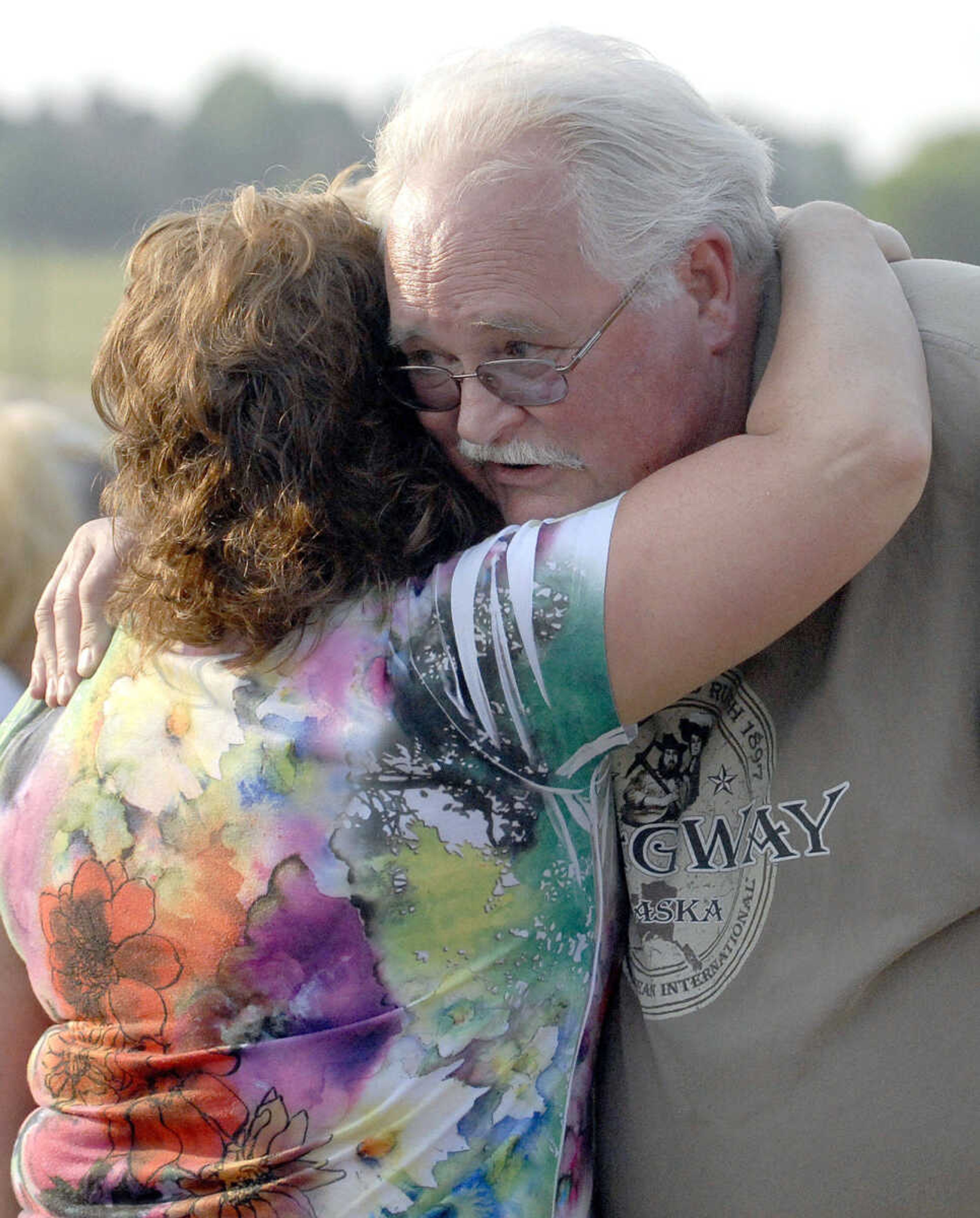 LAURA SIMON~lsimon@semissourian.com
Jacque Sue Waller's father Stan Rawson is consoled Thursday, June 9, 2011 during a prayer service for Waller at Farmington High School. Waller, a 39-year-old mother of three, has been missing since June 1, 2011.