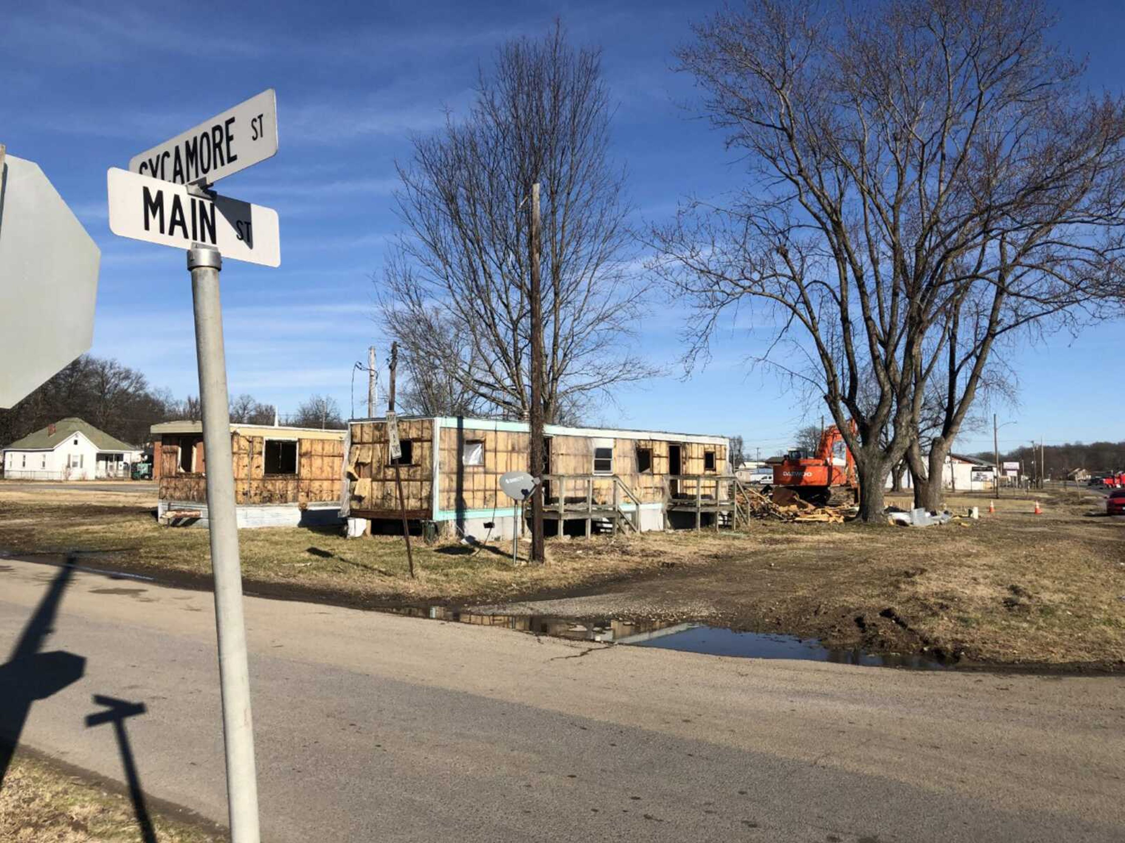 Portions of two mobile homes were visible Monday on a lot at the corner of Main and Sycamore streets in Scott City. The Scott City Council recently purchased the lot and is clearing it for future development.