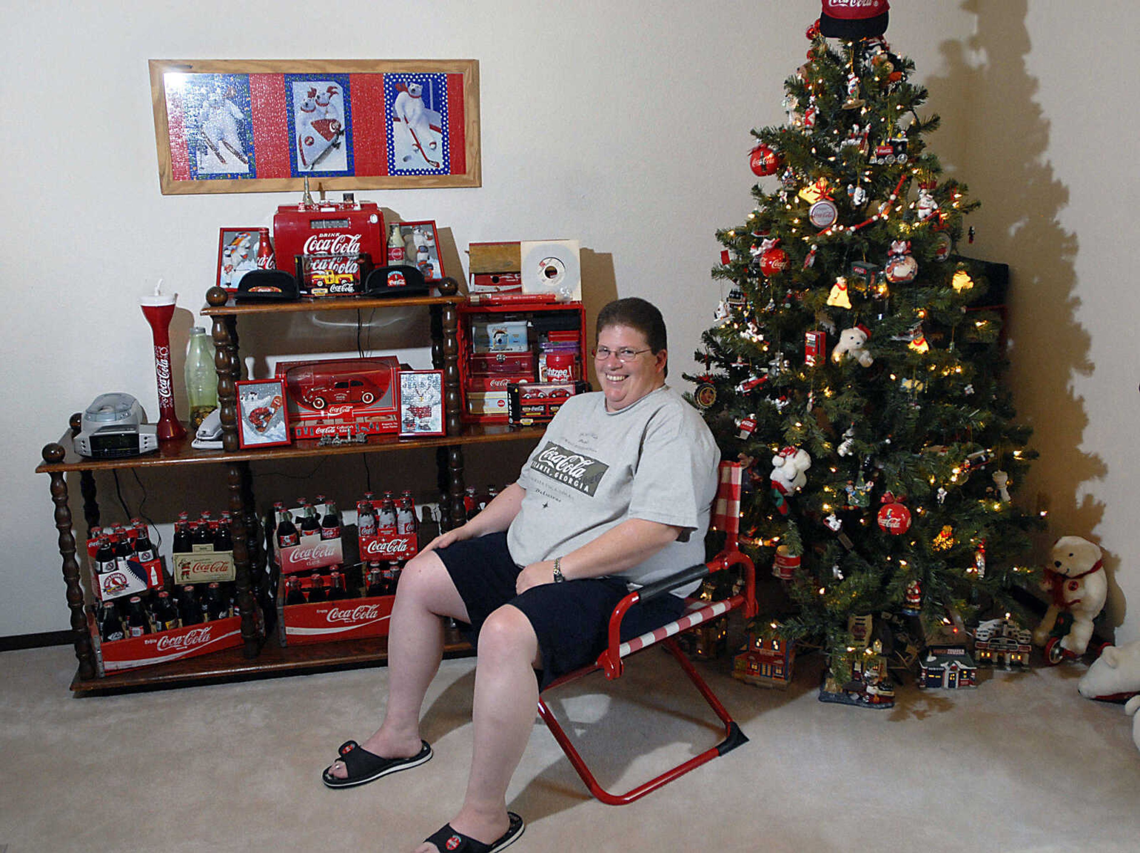 KIT DOYLE ~ kdoyle@semissourian.com
Leah Kortmeyer maintains a Christmas tree year-round to display some of her many Coca-Cola ornaments.  Kortmeyer believes that she has more than 1,500 Coca-Cola memorabilia items, including more than 150 bottles.