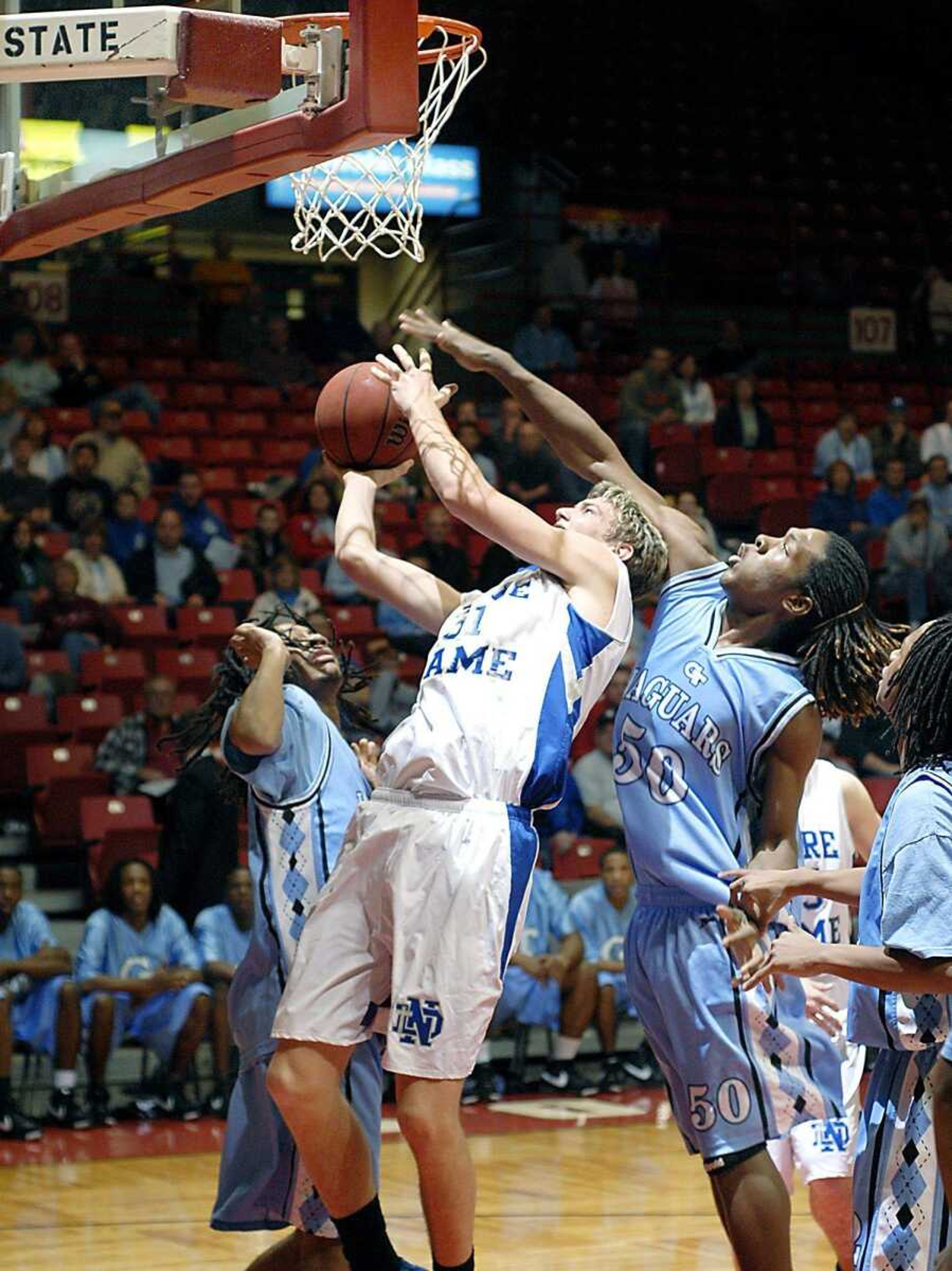 Notre Dame senior Ryan Willen, center, drew a foul from Gateway Tech defender Corey Breeding (50) during the Pepsi Showcase on Saturday at the Show Me Center. (Kit Doyle)