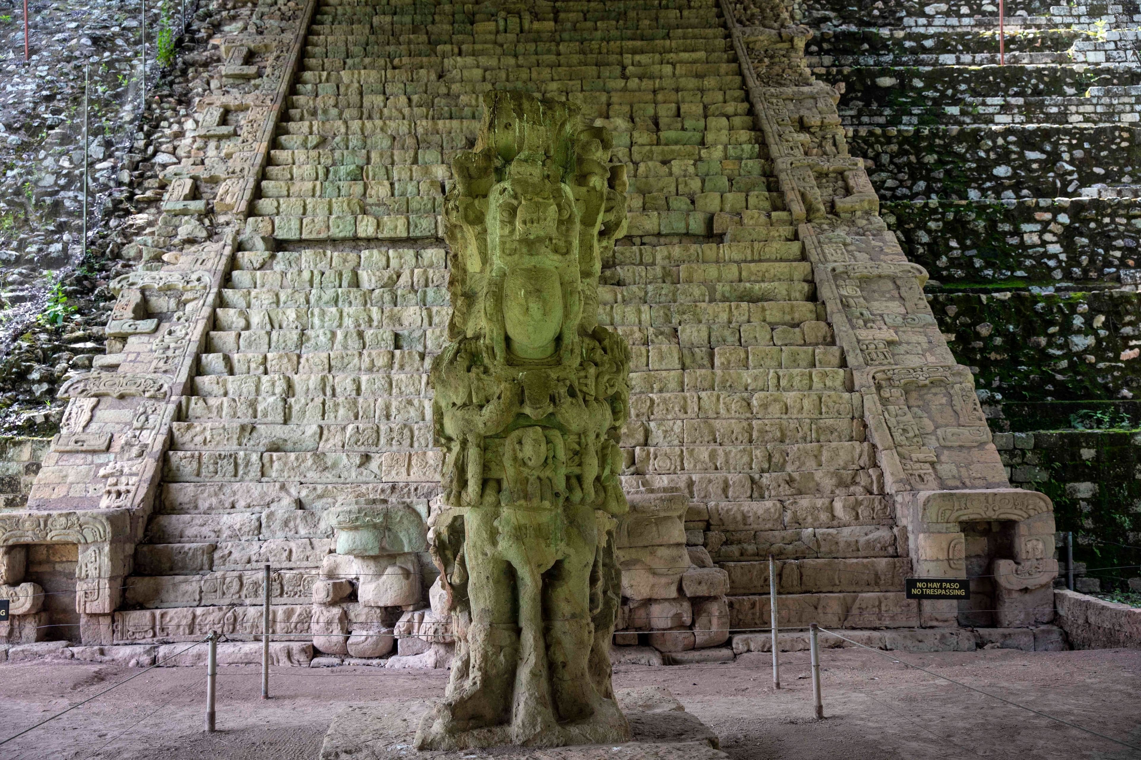 FILE - Stela M and the Hieroglyphic Stairway are seen inside the archeological site of Copan, in Copan Ruinas, Honduras, Saturday, July 3, 2021. (AP Photo/Rodrigo Abd, File)