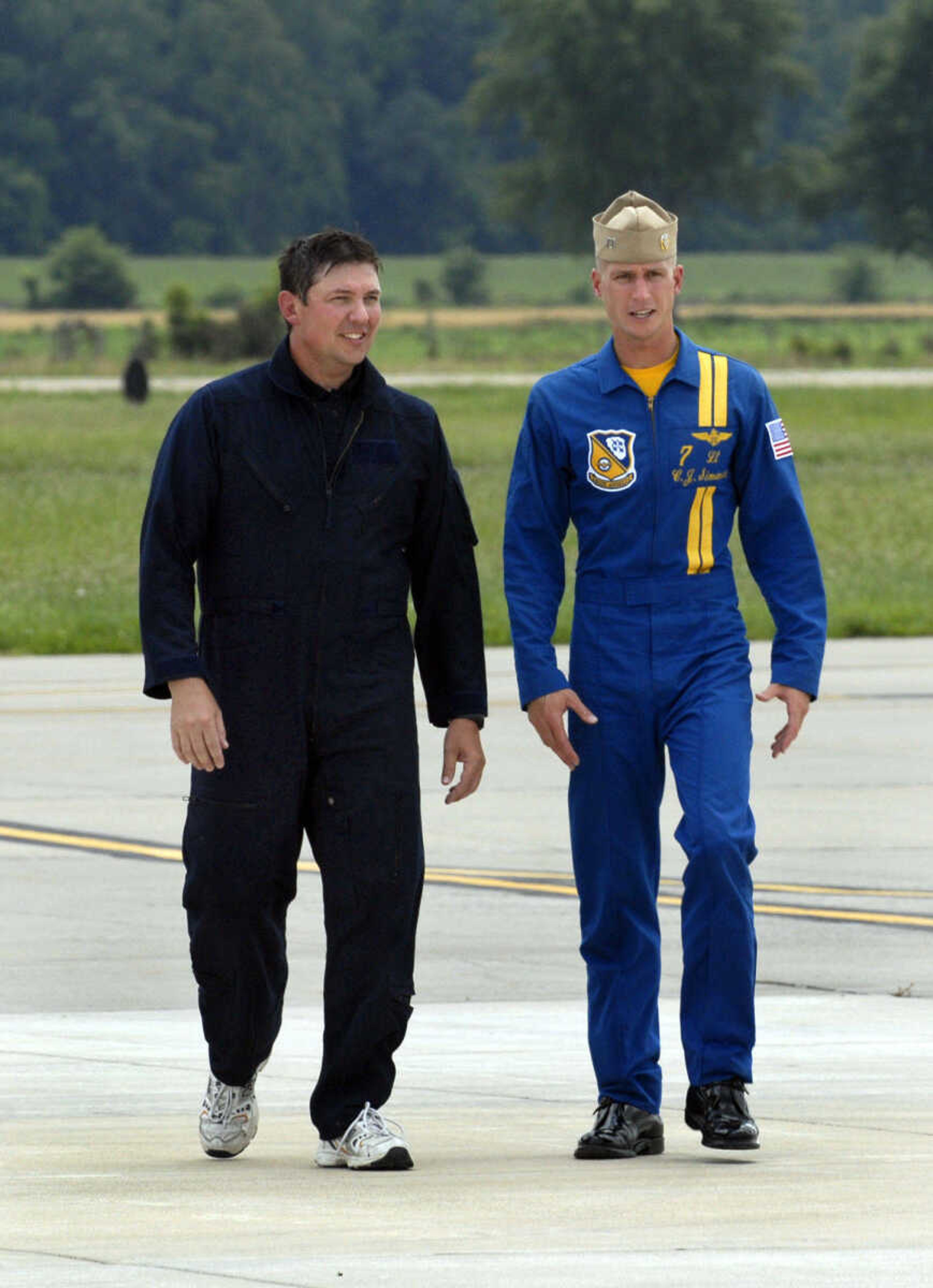 KRISTIN EBERTS ~ keberts@semissourian.com

Rob Bunger, left, walks across the tarmac with Blue Angel pilot Lt. C.J. Simonsen after landing at the Cape Girardeau Airport on Wednesday, June 16, 2010. Bunger was one of three area people who got the chance to fly in the Blue Angels' F/A-18 on Wednesday.