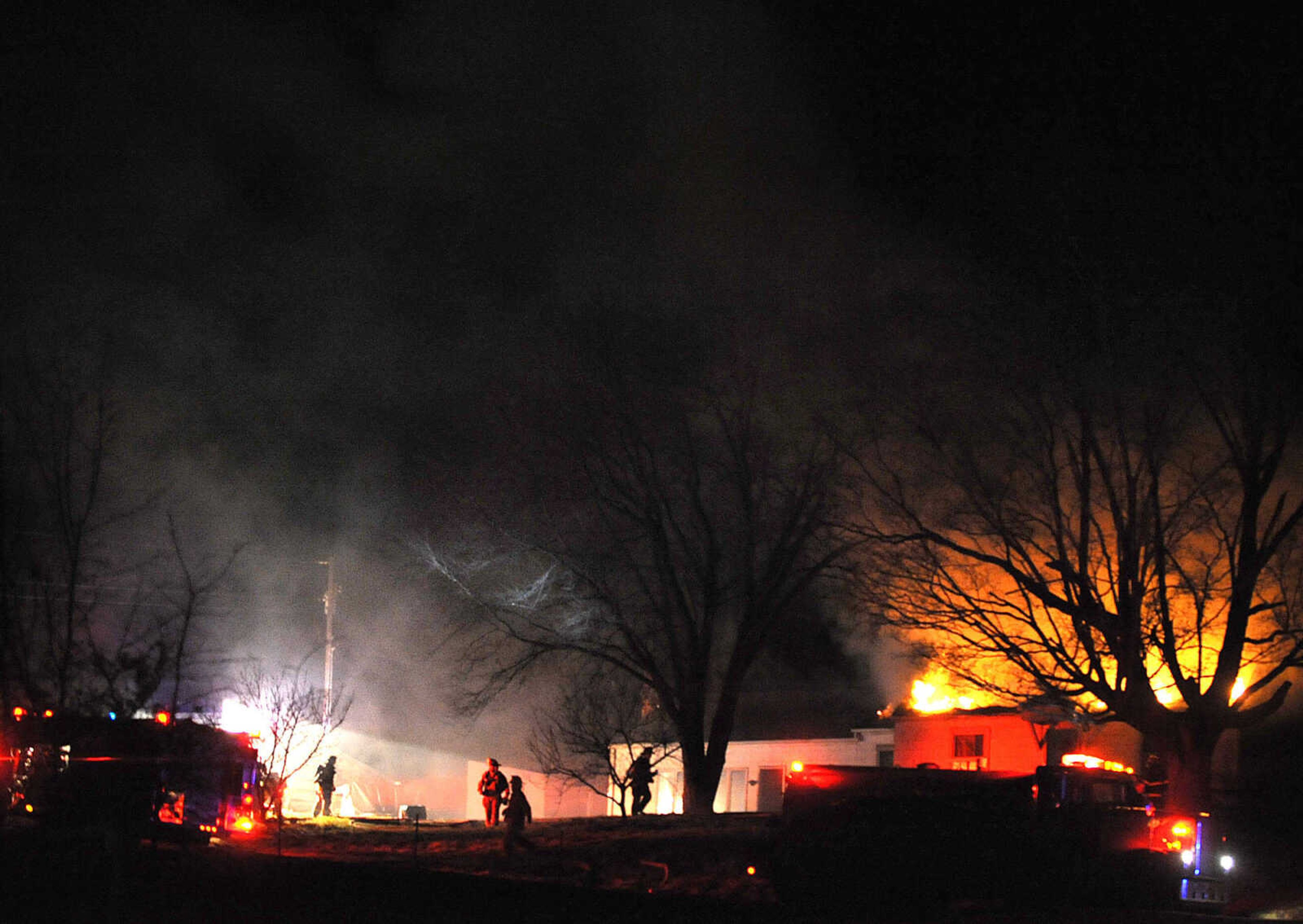 LAURA SIMON ~ lsimon@semissourian.com
Firefighters from Delta, Gordonville, Cape Girardeau, Millersville, Fruitland and East County Fire Departments battle a structure fire Wednesday night, January 9, 2012 on Onyx Lane in Cape Girardeau.