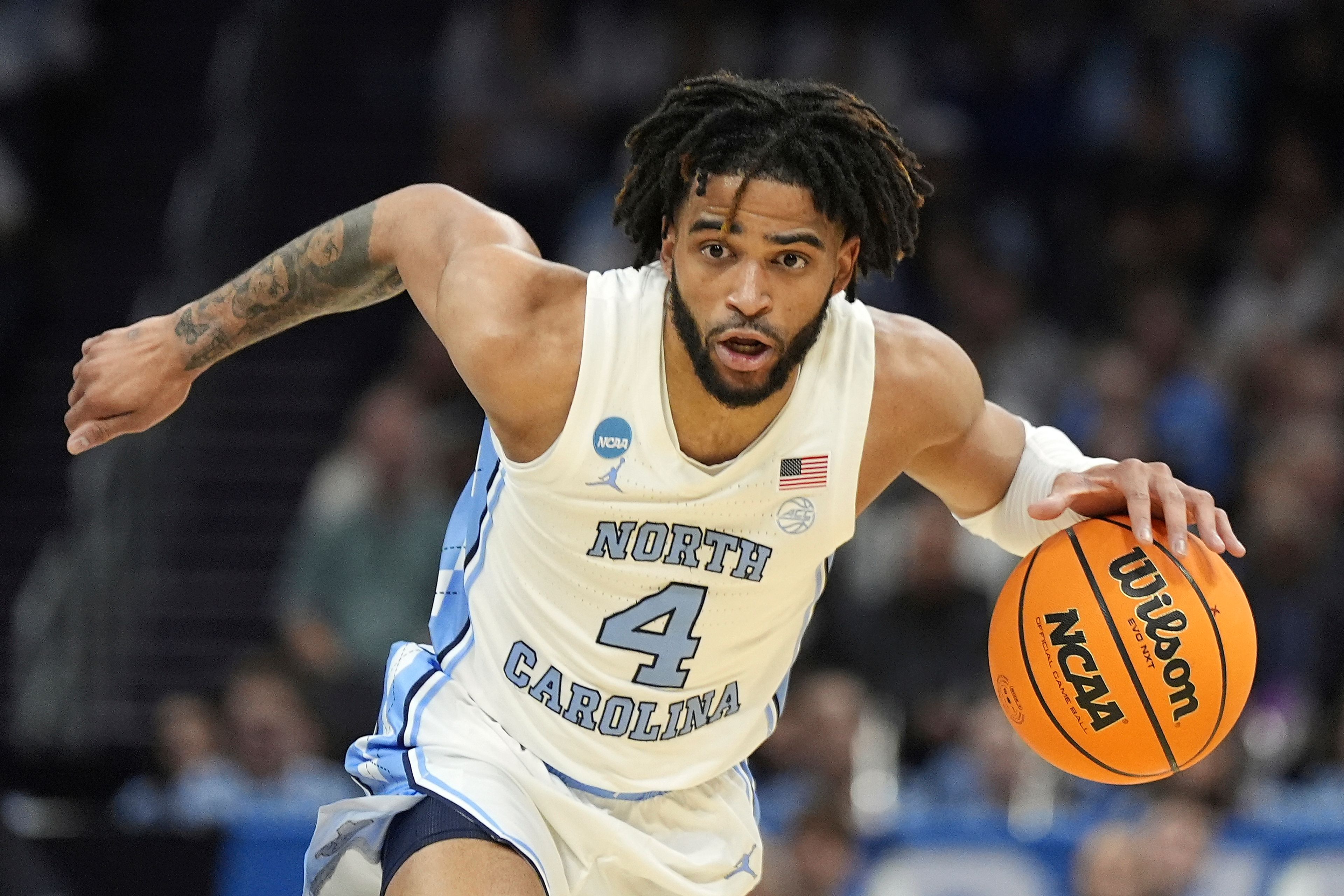 FILE - North Carolina guard RJ Davis (4) brings the ball down court during the first half of a second-round college basketball game against Michigan State in the NCAA Tournament, Saturday, March 23, 2024, in Charlotte, N.C. (AP Photo/Chris Carlson, File)