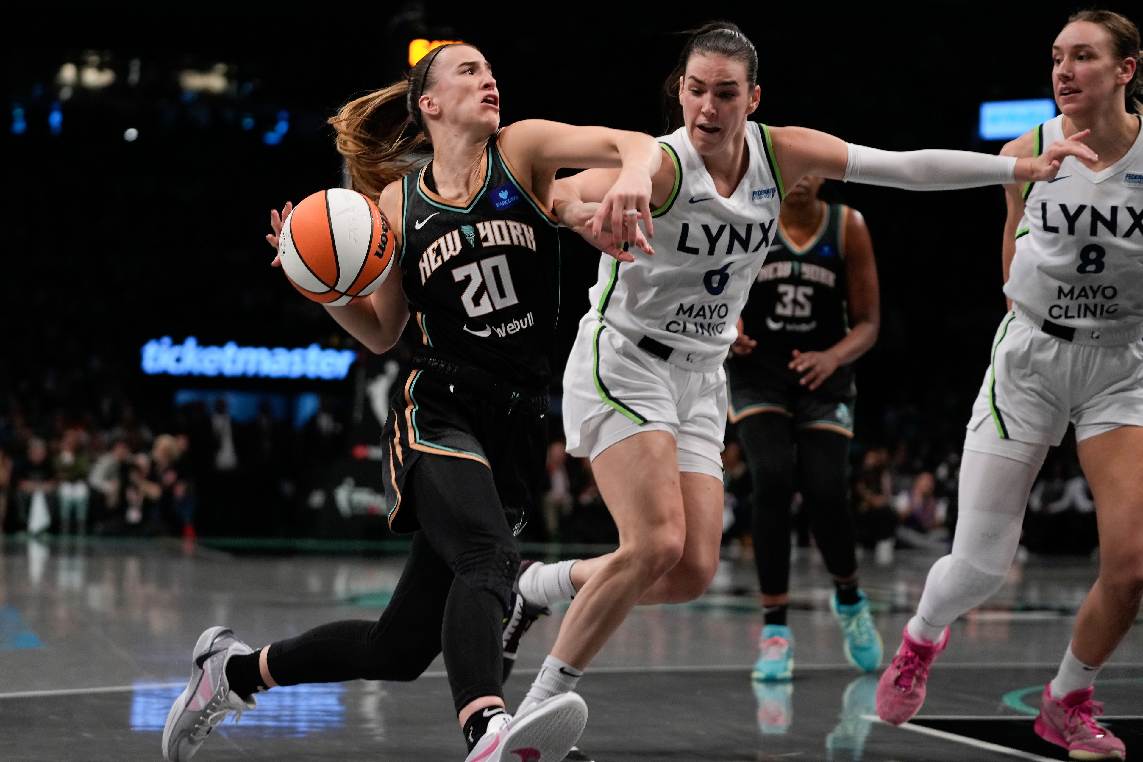 New York Liberty guard Sabrina Ionescu (20) drives against Minnesota Lynx forward Bridget Carleton (6) during the second quarter of Game 5 of the WNBA basketball final series, Sunday, Oct. 20, 2024, in New York. (AP Photo/Pamela Smith)