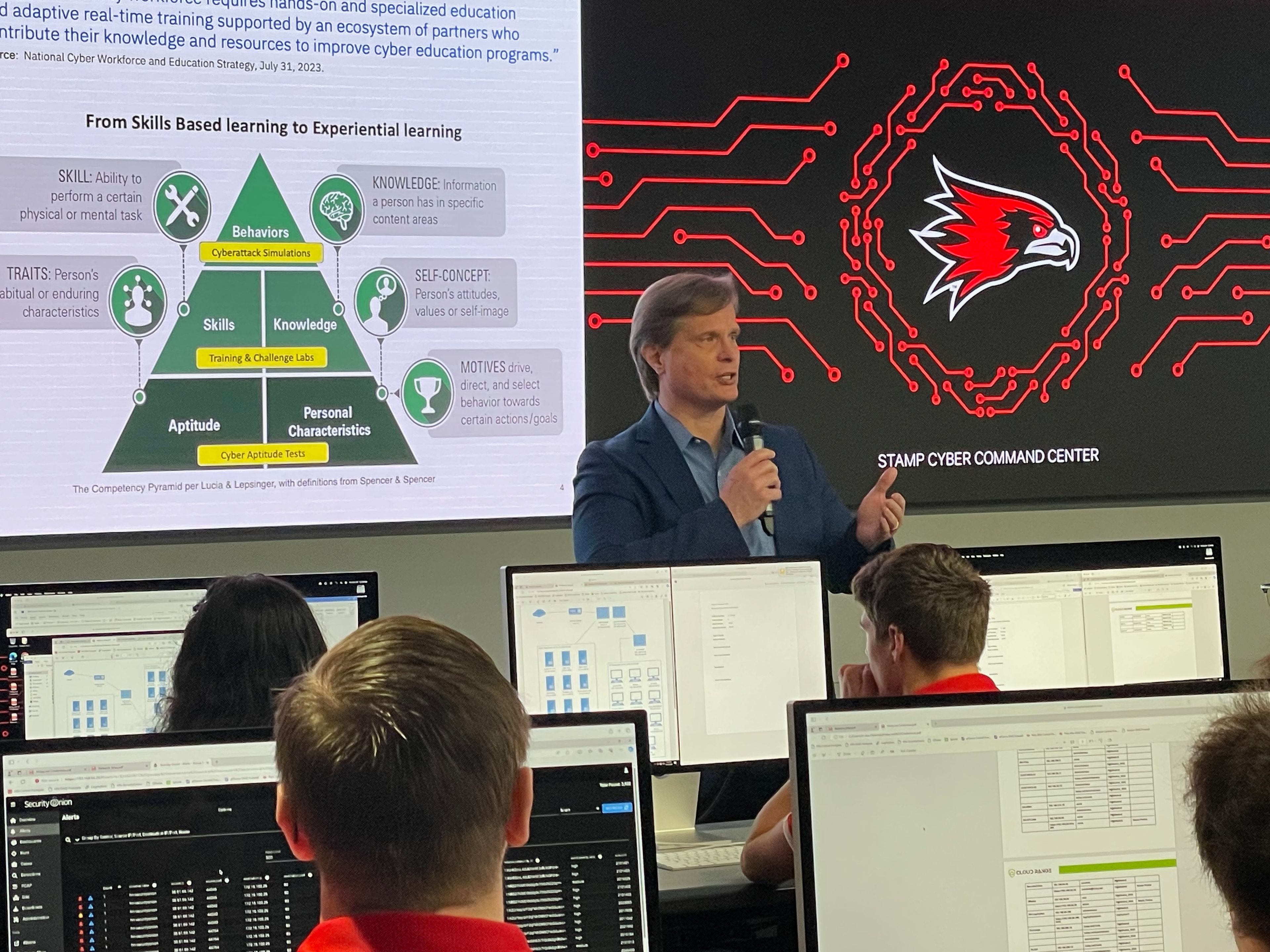 Rob Koehler, IBM Cyber Campus Offering Leader, explains to the crowd the importance of gaining experience in threat mitigation -- versus simply studying it in theory. The Cyber Command Center at SEMO is at the global forefront of experiential learning for students.