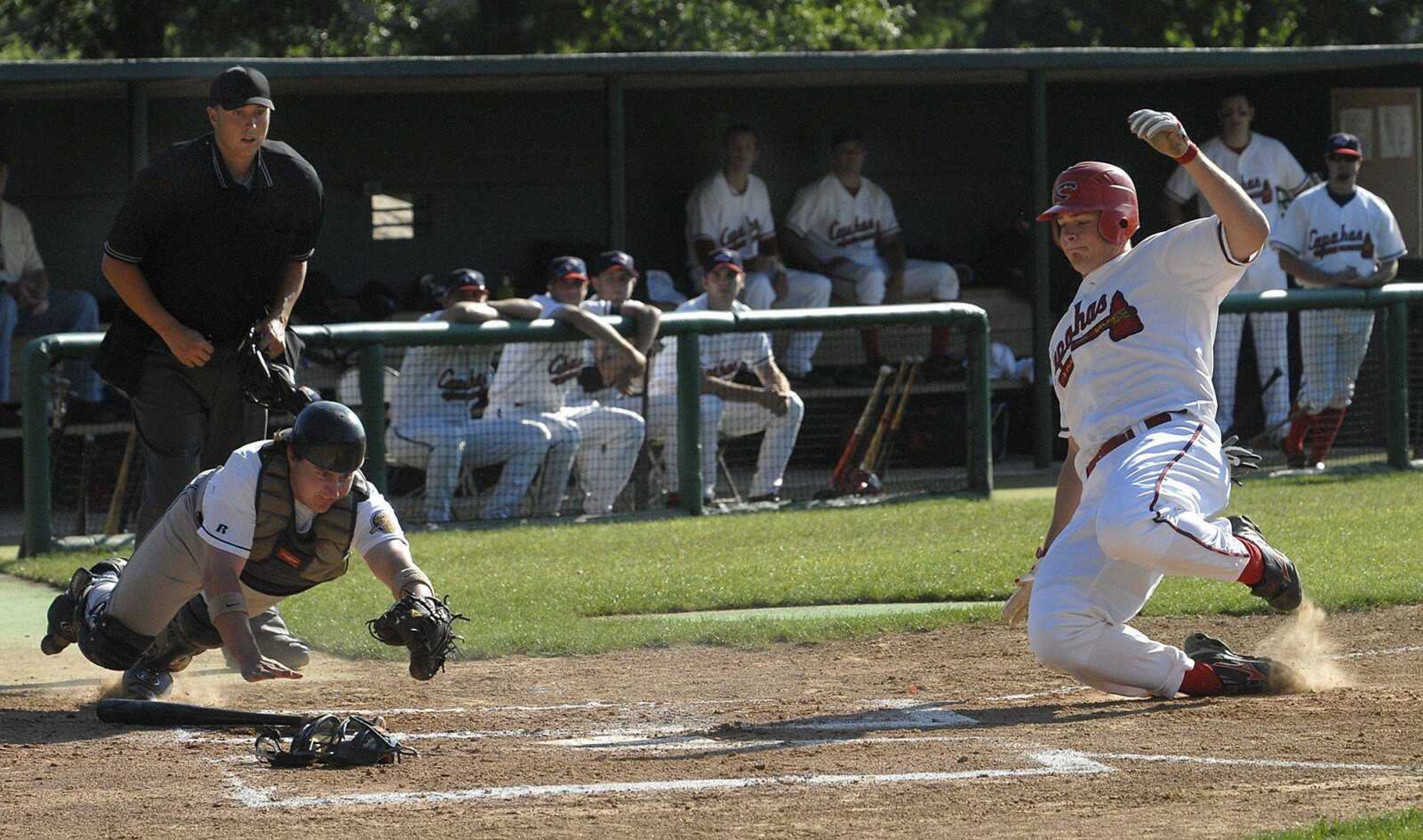 Capahas baserunner Matt Wagner tries to score, but Riverdogs catcher Greg Craft beat him to the plate during the first inning Sunday at Capaha Field. (Fred Lynch)