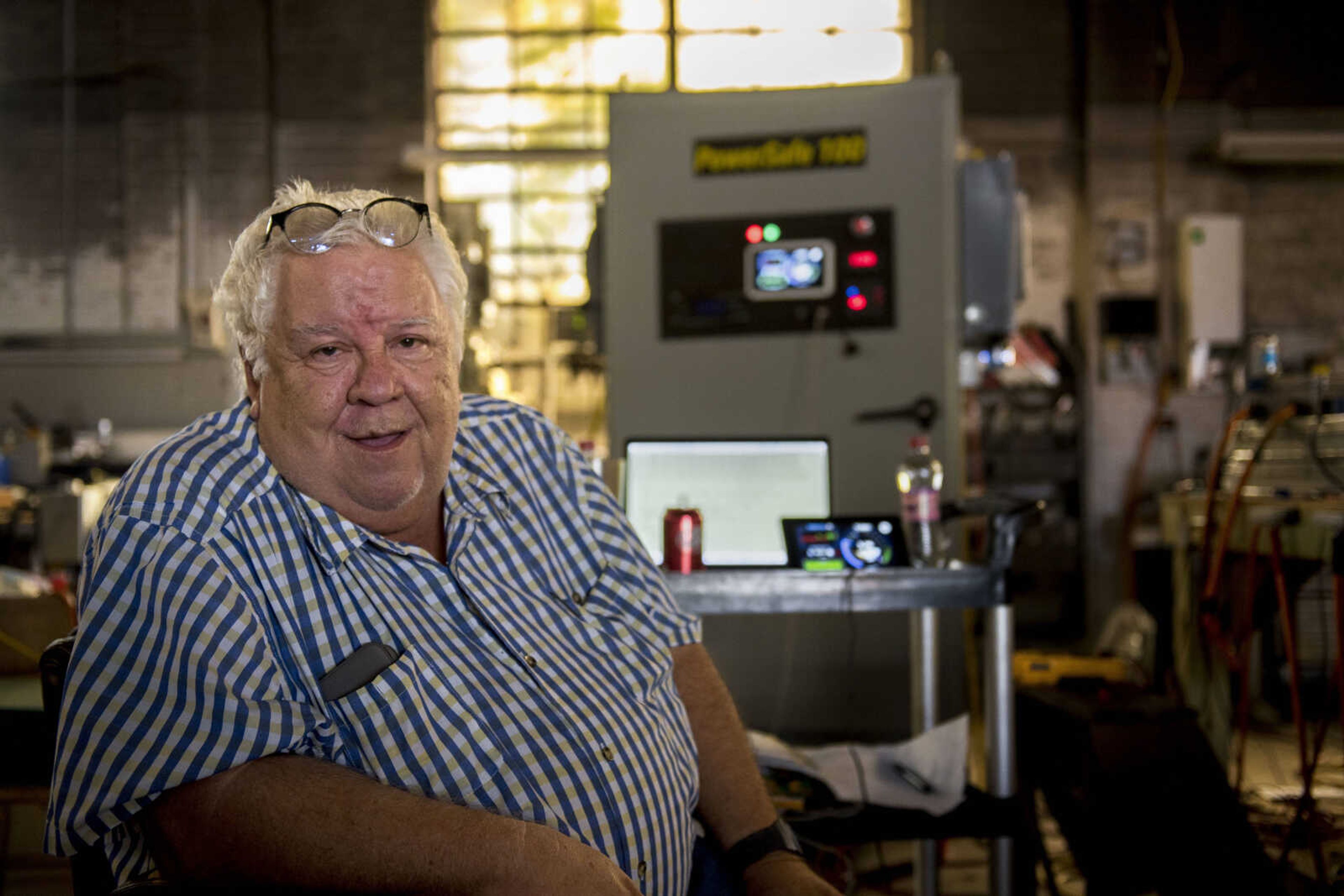 Entrepreneur and electrical engineer Jack Rickard poses for a portrait in his workshop Tuesday, October 9, 2018, in front of his current project, the PowerSafe 100, an energy bank made of discarded Tesla batteries. The goal, Rickard said, is to make solar energy a feasible alternative energy source, even if most people don't quite understand his project.
"People say, 'Don't go in there, he plays with lightning,'" he said.