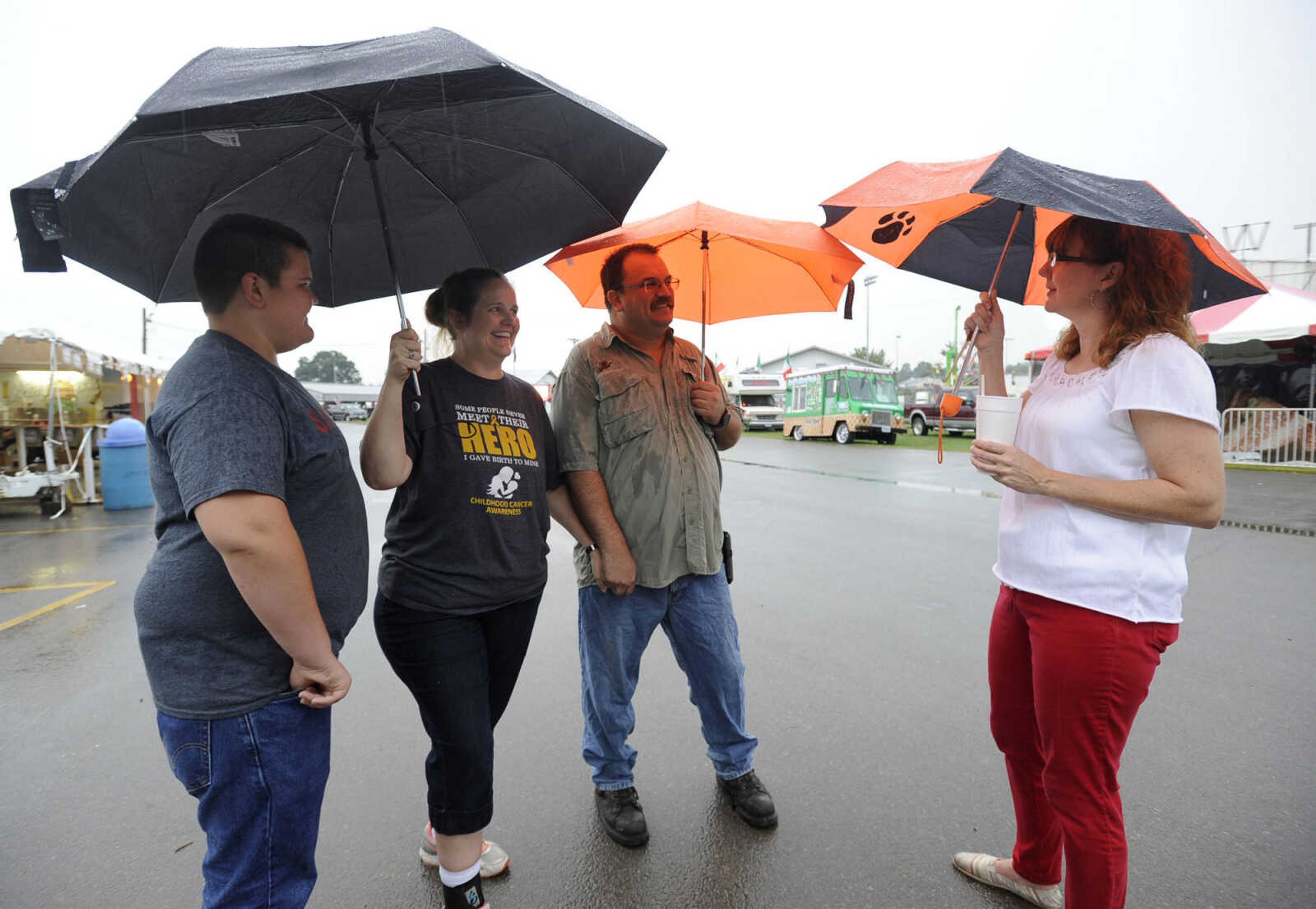 Trenton Beard, left, Debbie Beard and Charlie Beard of Oak Ridge talk with Mary Gray of Gordonville Thursday, Sept. 15, 2016 at the SEMO District Fair in Cape Girardeau.