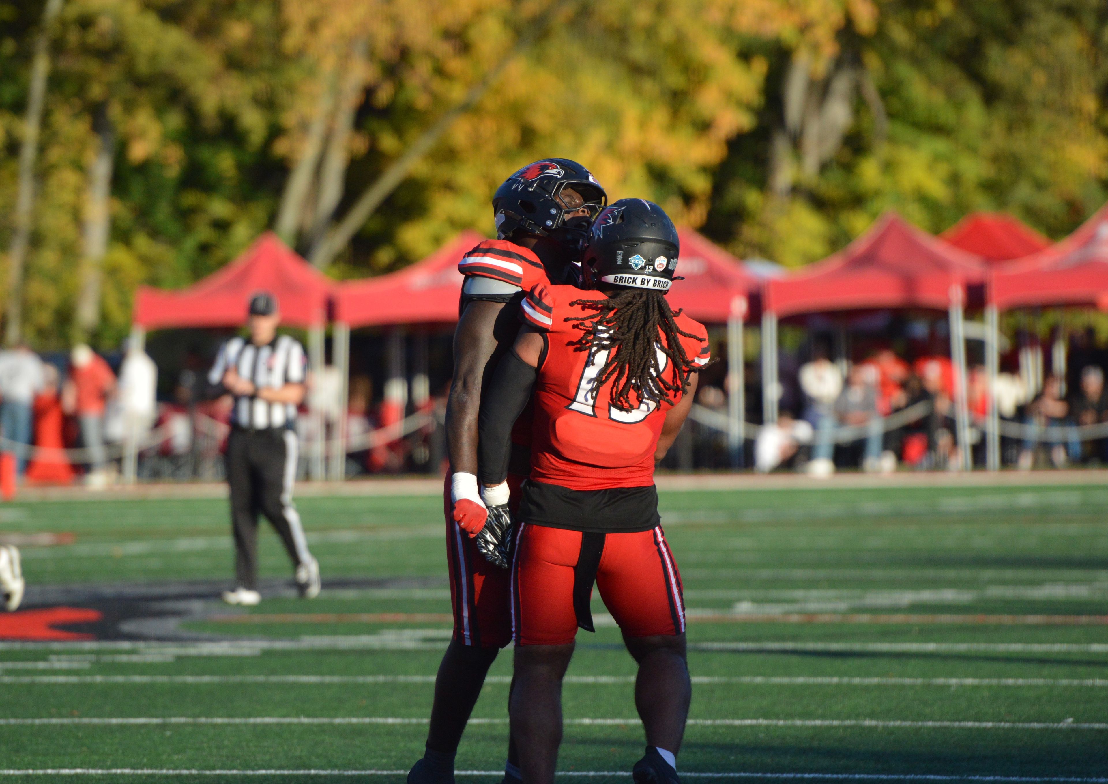 SEMO defensive lineman Nasim Cairo, left, and linebacker Mali Walton, right, celebrate after a big stop against Gardner-Webb on Saturday, Oct. 26.