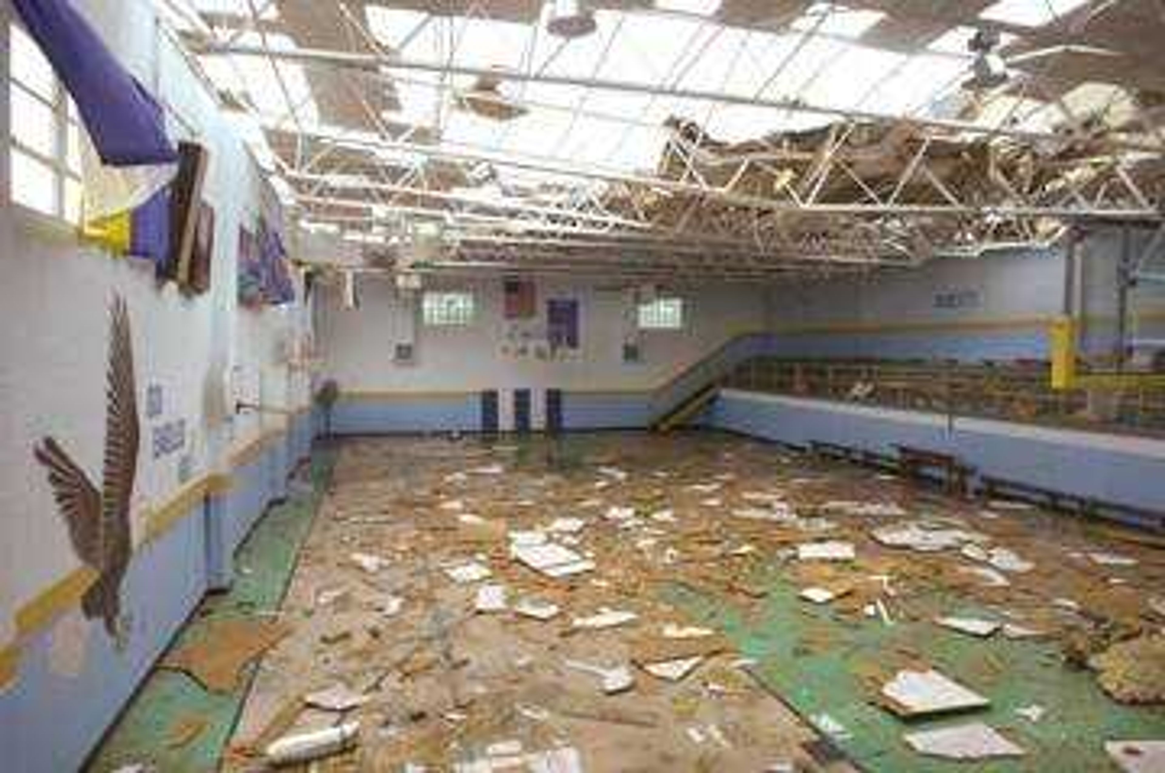 The tornado ripped up the roof and scattered debris over the basketball floor of the gymnasium at Immaculate Conception Catholic School, 308 S. Hope St. in Jackson.