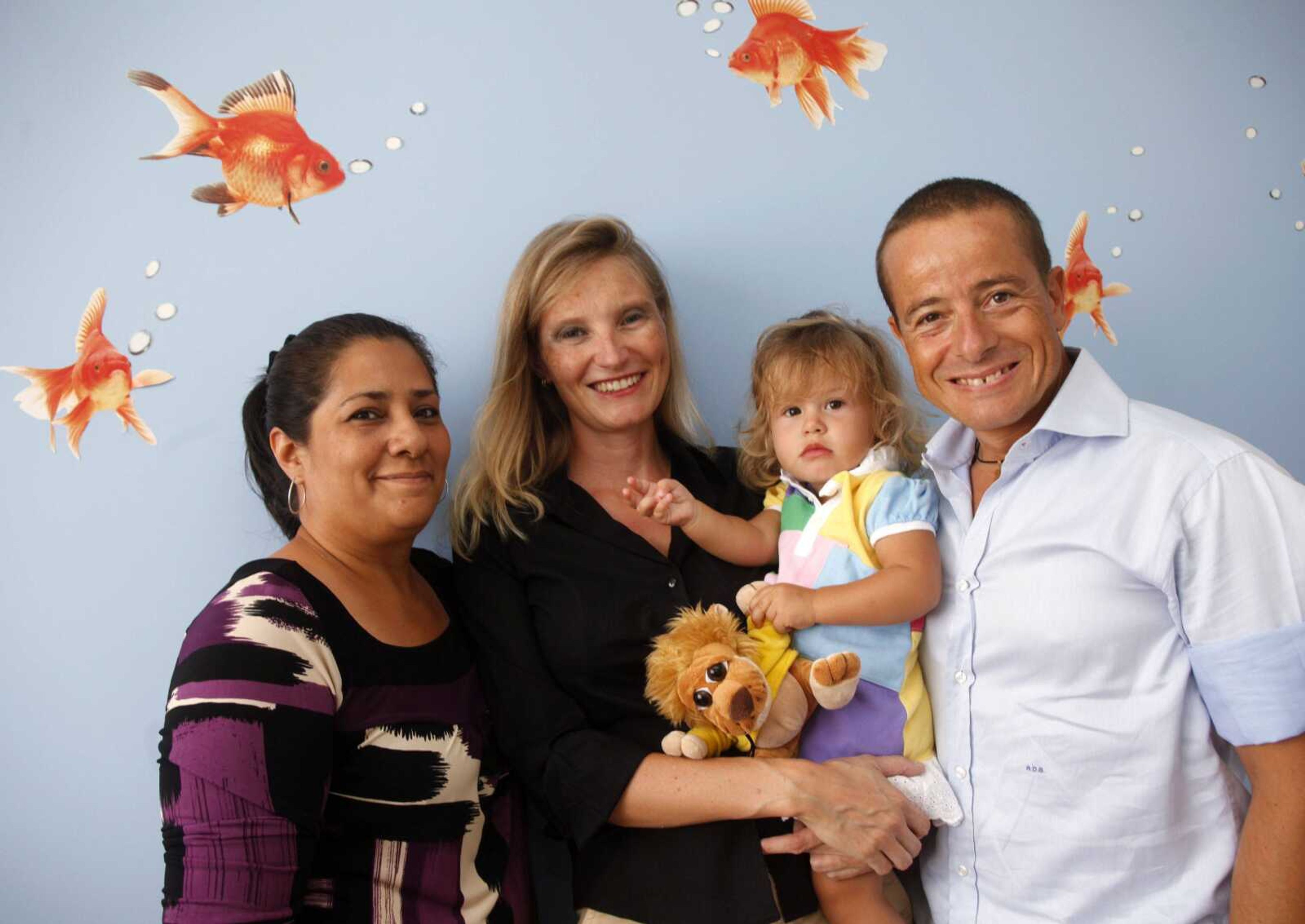 Alice Di Giovanni, second from right, poses with her father Antonello Di Giovanni, right, her mother Anna Manikowska, second from left, and her nanny Marisol Espinoza Lazo in Miami Beach, Fla. (Wilfredo Lee ~ Associated Press)