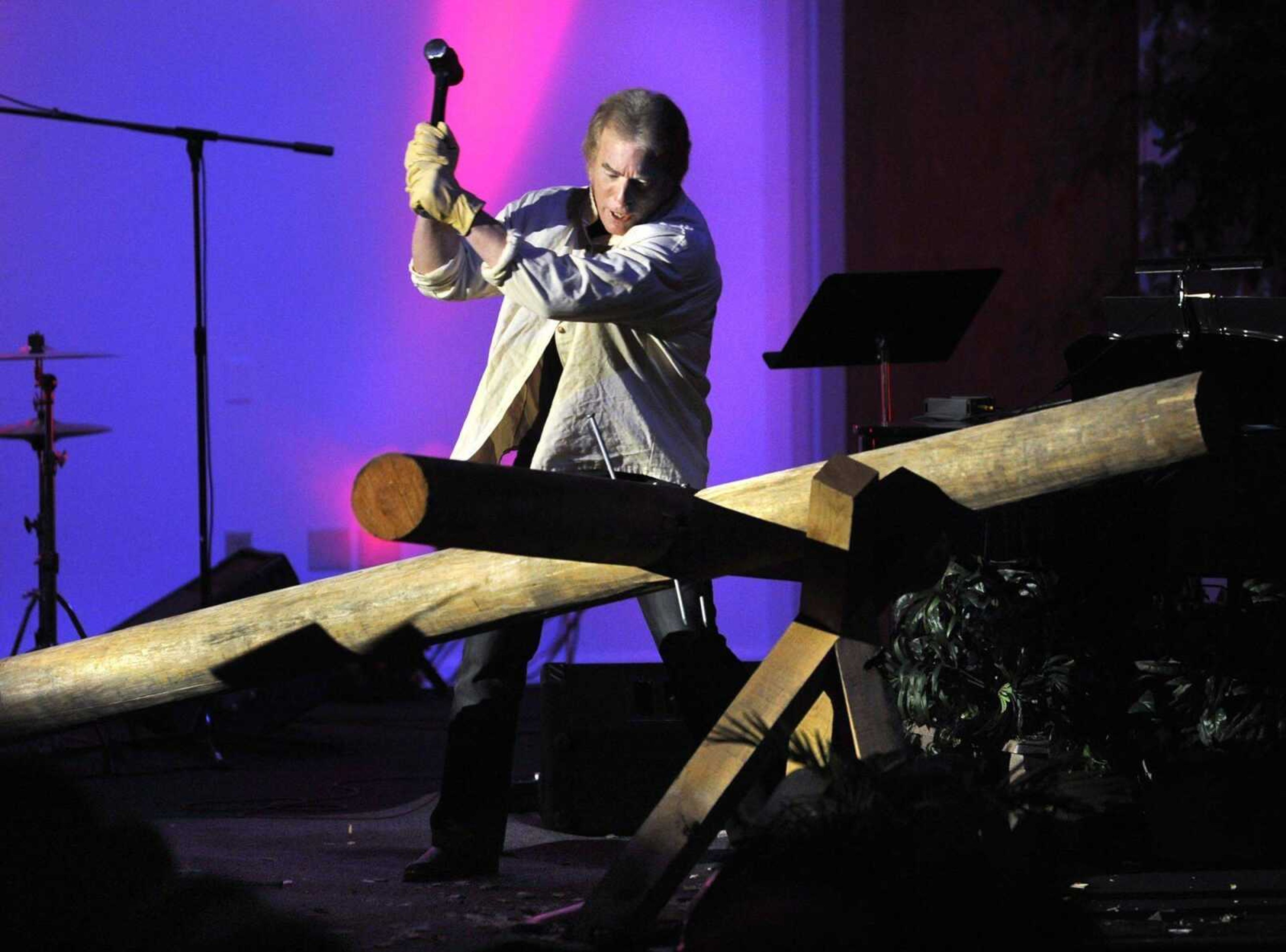 Joe White, president and founder of Men at the Cross, portrays a Roman cross builder while setting the stage for a marriage conference Friday, Nov. 4, 2011 at Lynwood Baptist Church in Cape Girardeau. (Fred Lynch)