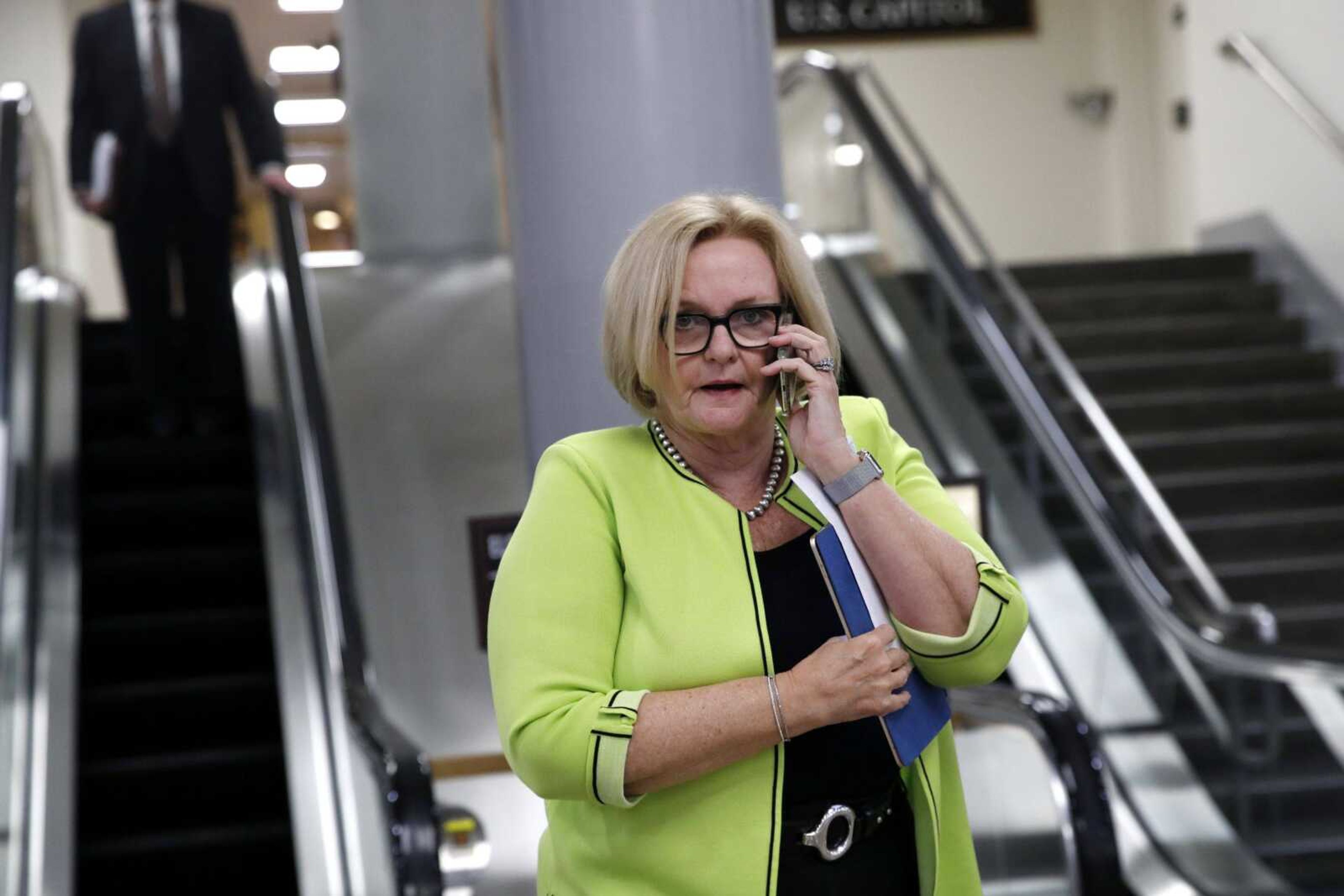 Sen. Claire McCaskill, D-Mo., walks through the Senate subway while on her phone Tuesday on Capitol Hill in Washington.