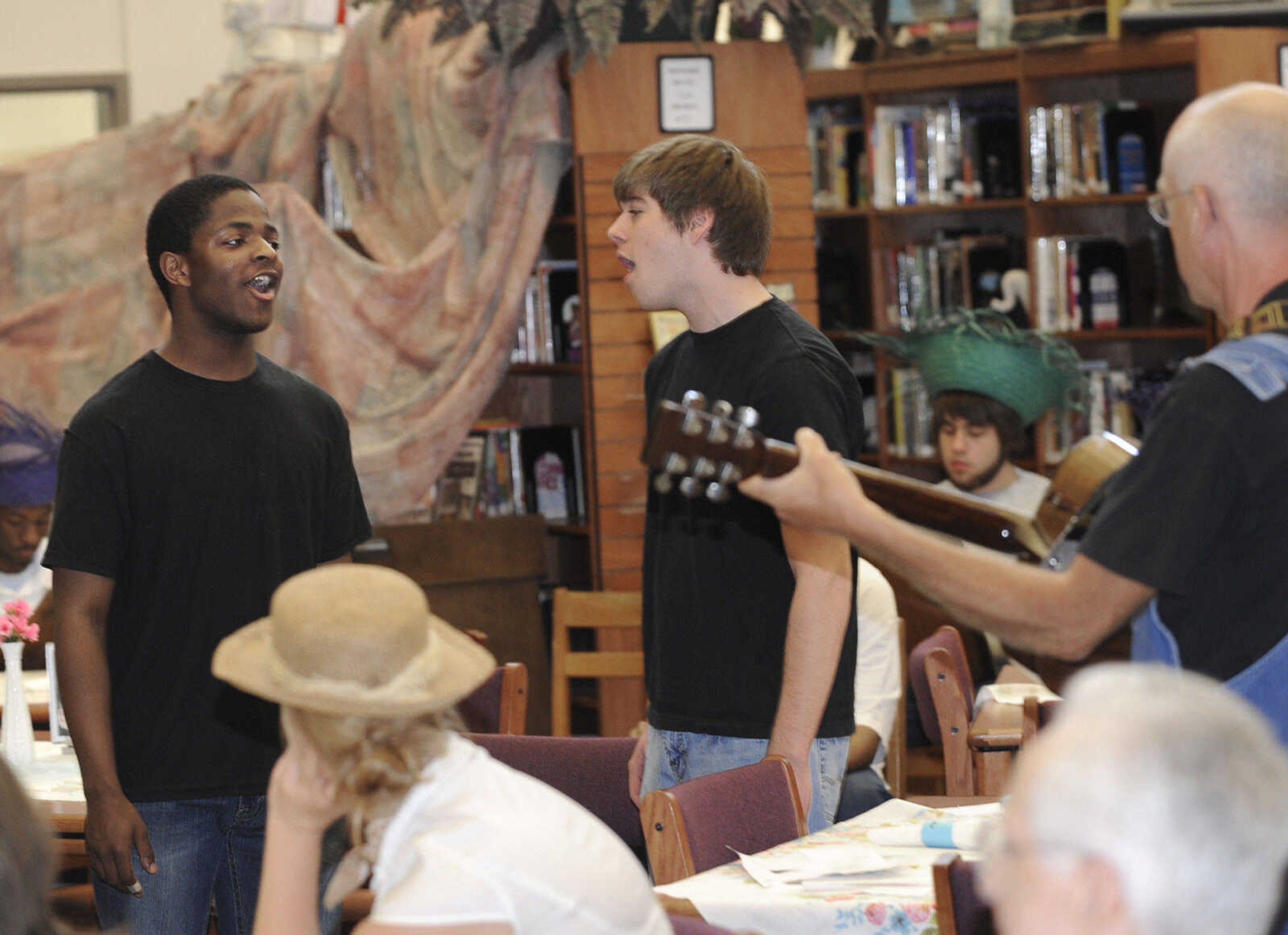 FRED LYNCH ~ flynch@semissourian.com
Brodrick Twiggs, left, and Ben Hendricks sing "World's Apart" from the musical Big River during the Mark Twain Centennial event Tuesday at Central High School.