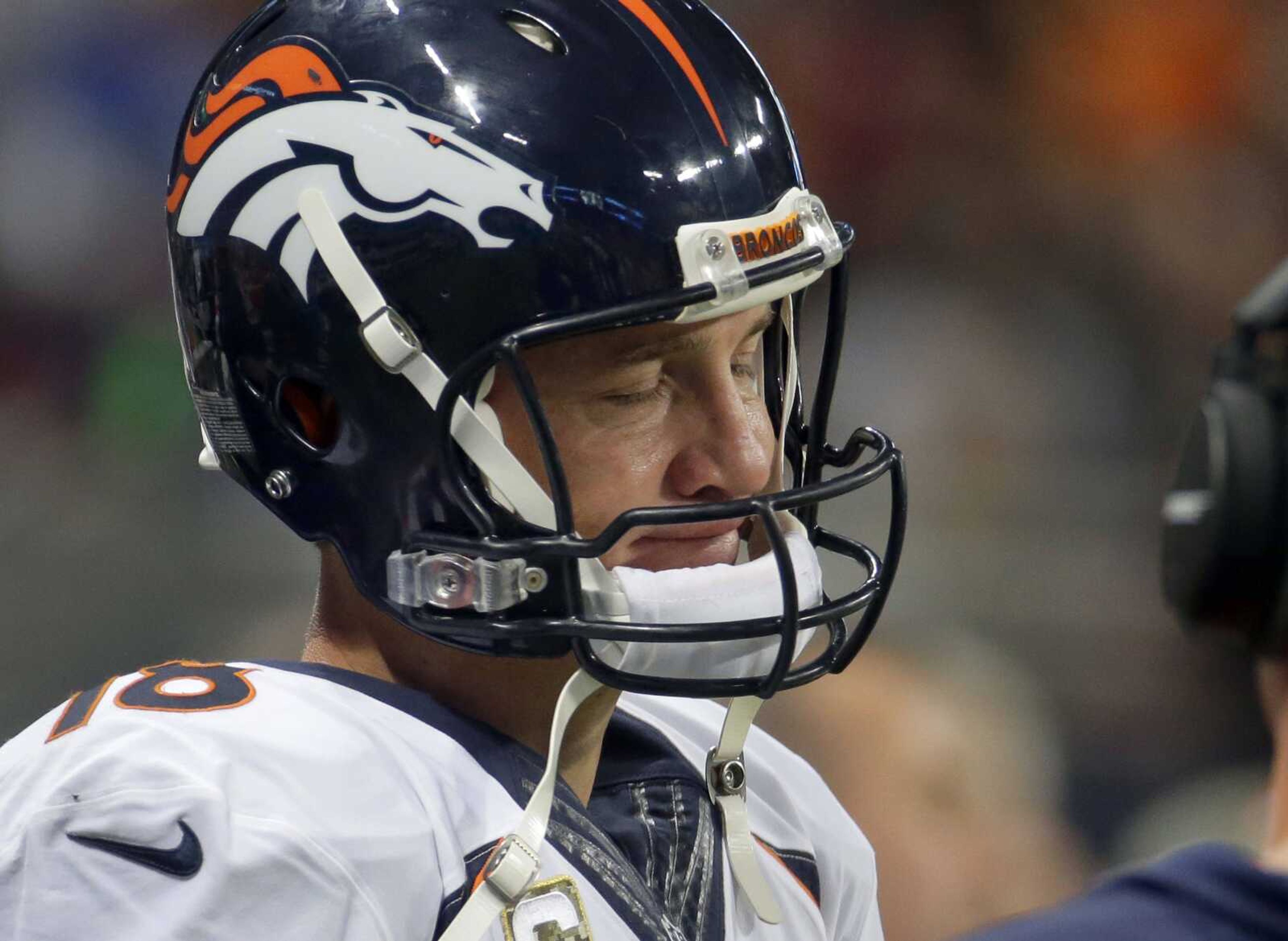 Broncos quarterback Peyton Manning stands on the sidelines during the fourth quarter of the Broncos' 22-7 loss to the Rams. (Charlie Riedel ~ Associated Press)