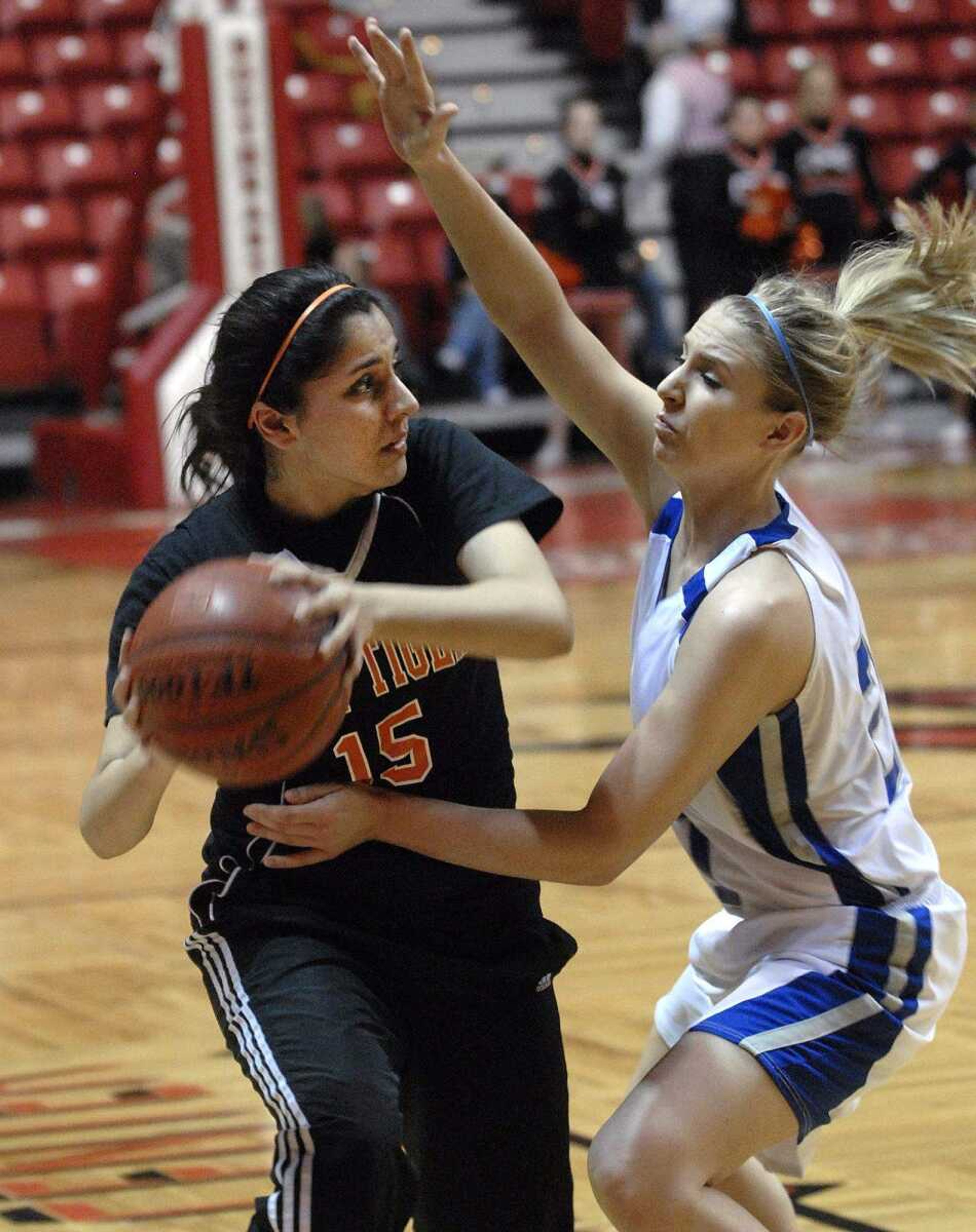 FRED LYNCH ~ flynch@semissourian.com
Central's Farrah Malik looks to pass as Notre Dame's Allyson Bradshaw defends in the second quarter Monday at the Show Me Center.