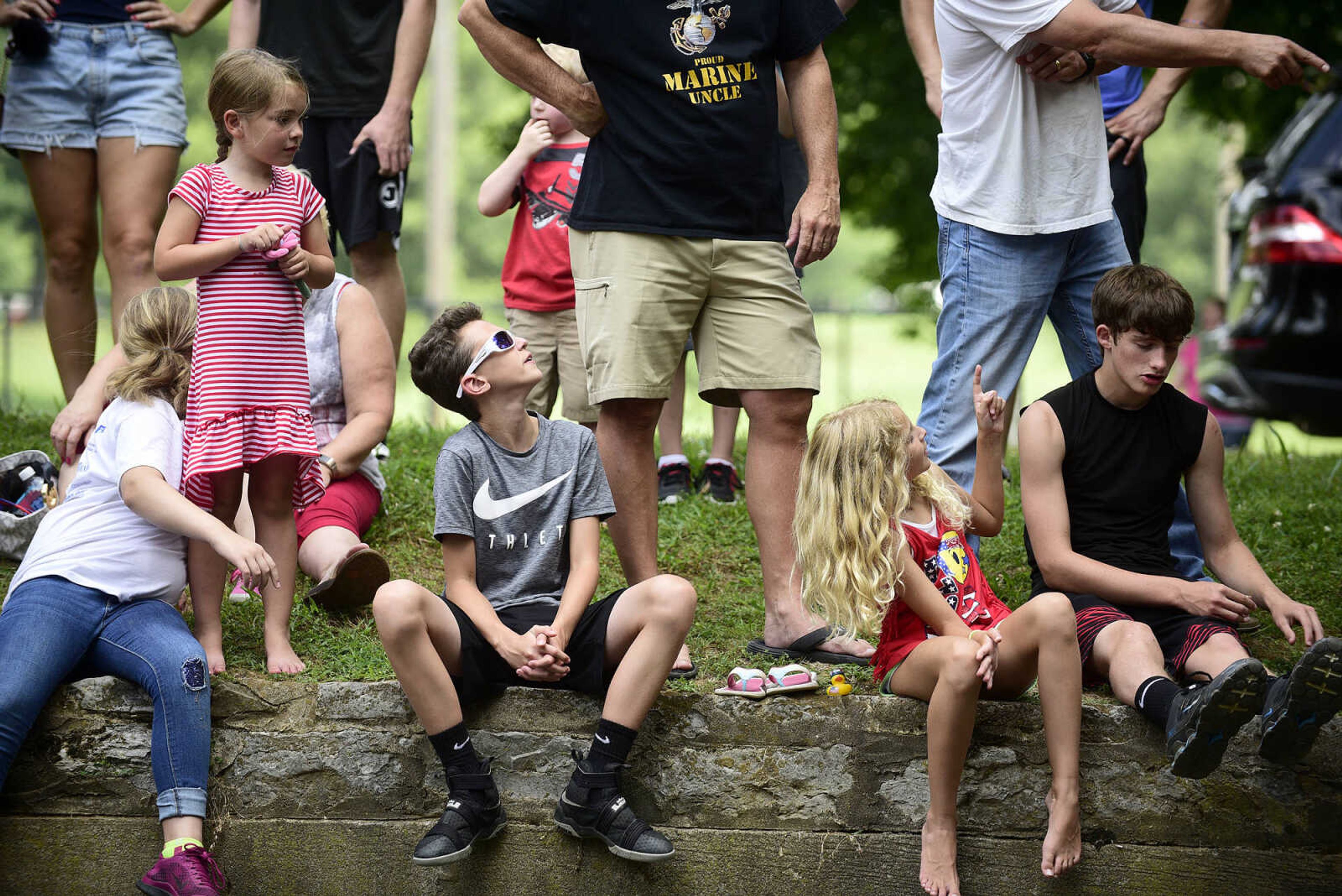 People take in the duck race during the Fourth of July celebration on Tuesday at Jackson City Park.