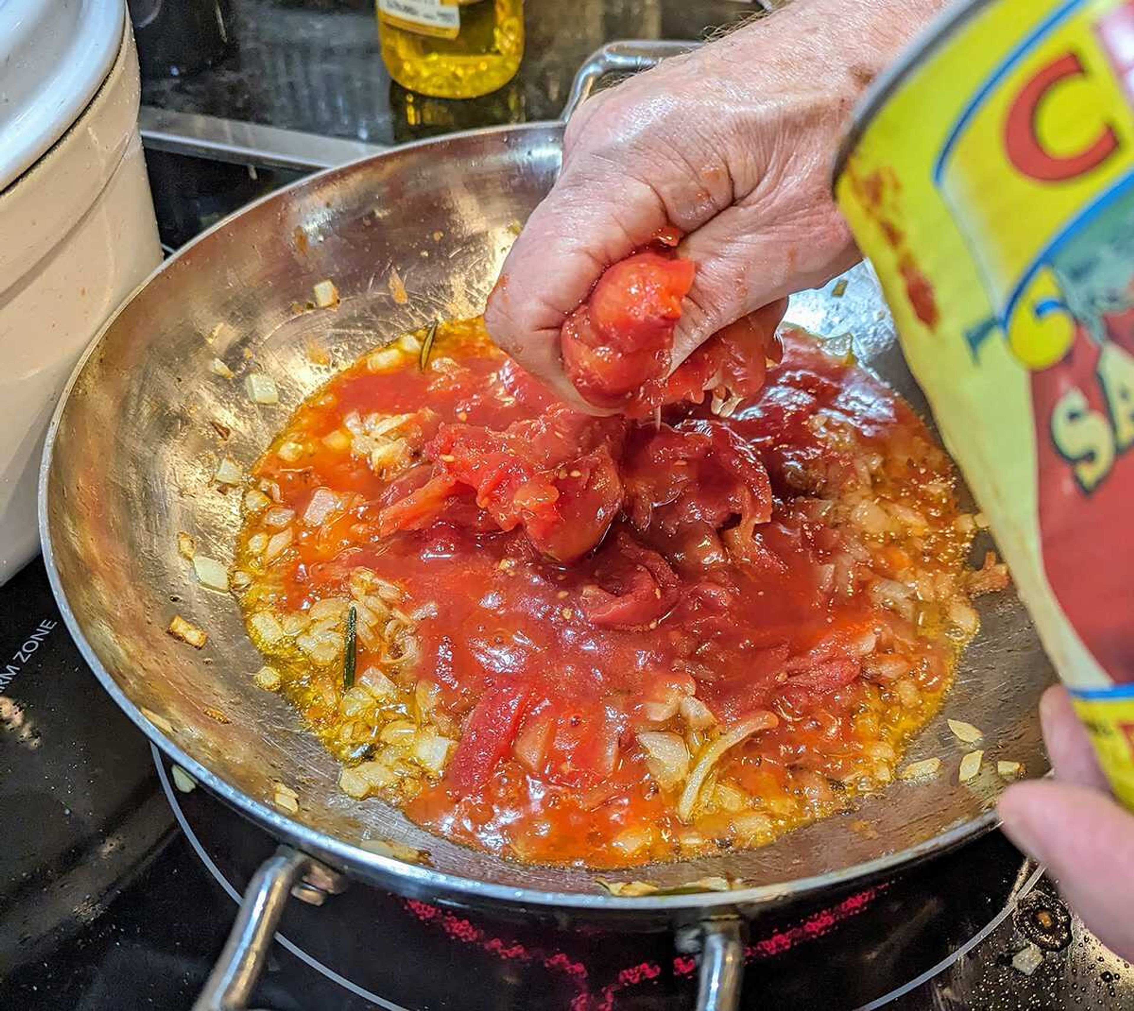 Authentic San Marzano tomatoes are invariably sold whole but can be diced or crushed using the cook's most versatile tool, immaculate hands.