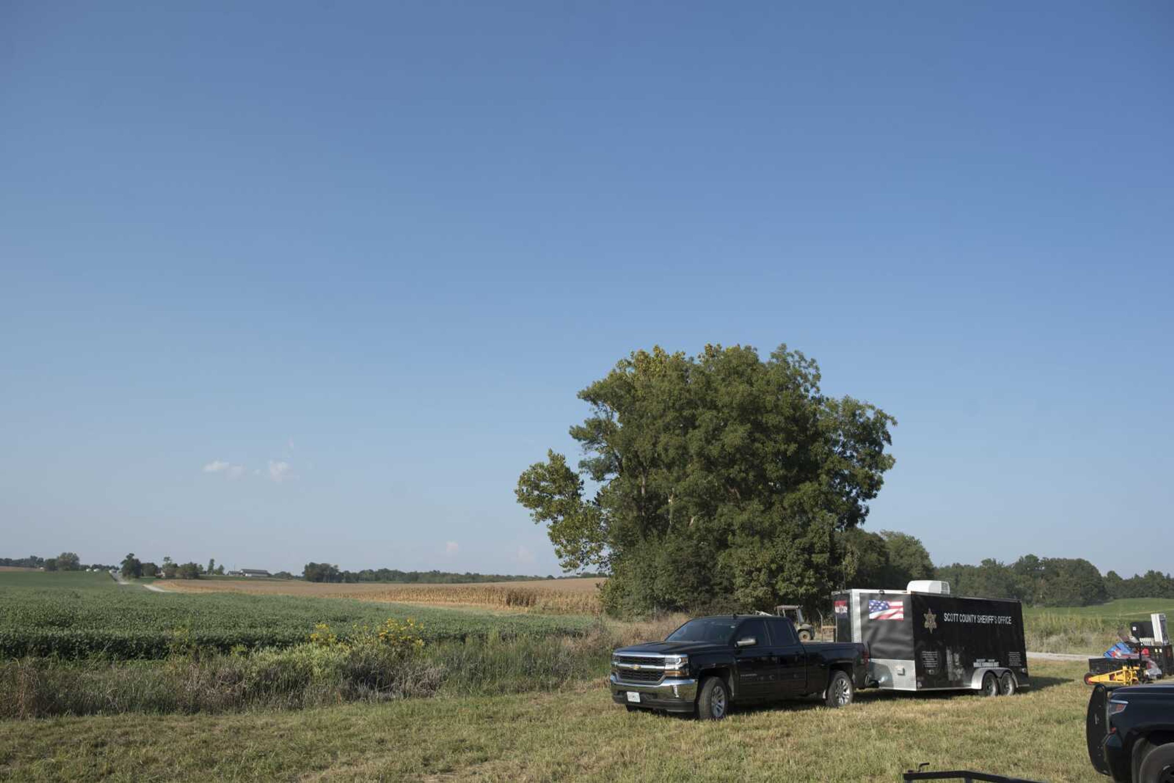 Members of the Scott County Sheriffs Department and FBI agents investigate a property along County Road 329 on Monday near Benton, Missouri.