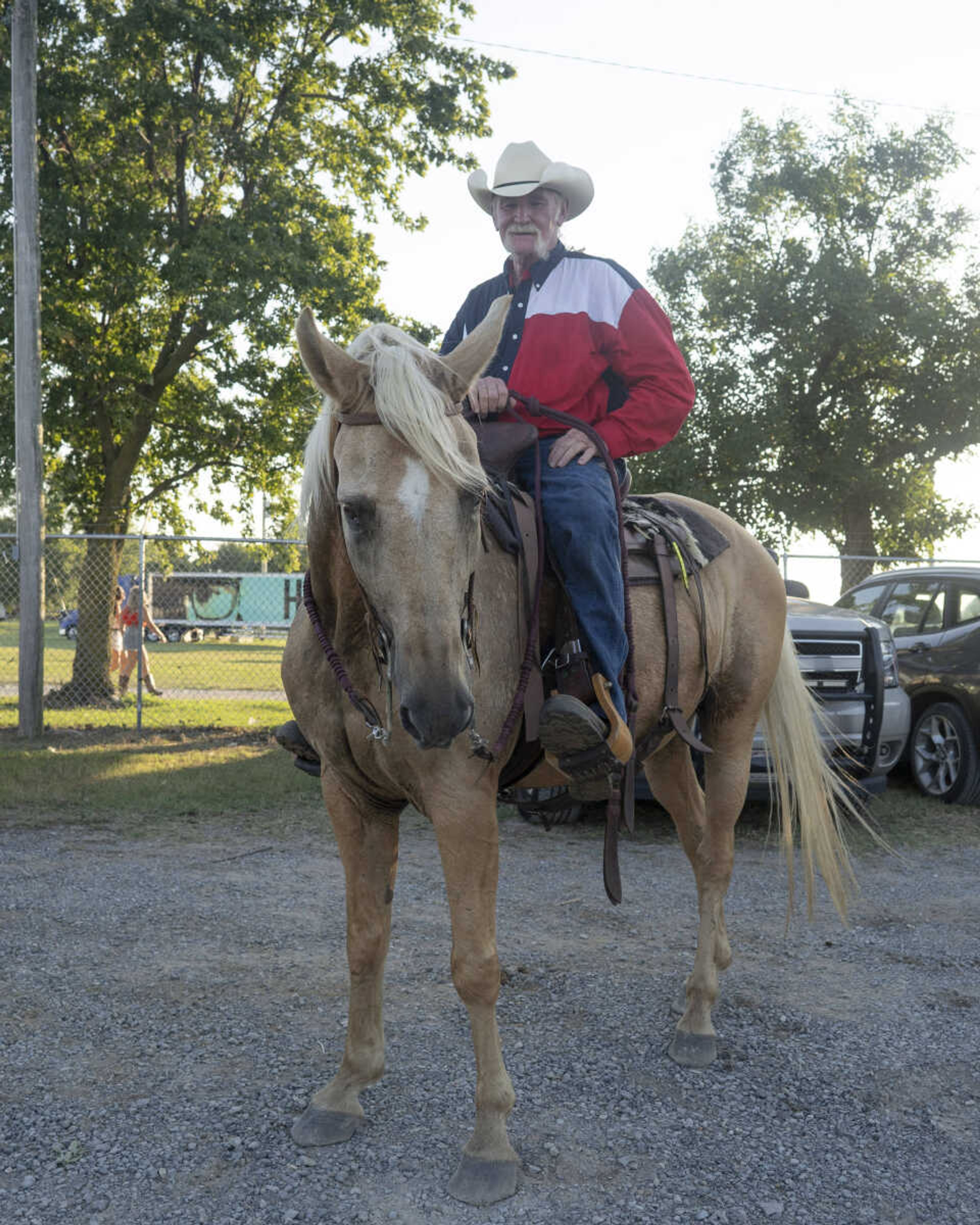 Johnny Richards is seen with his horse, Custer, one of "just 24"Вќ horses Richards keeps, before the opening ceremonies on the first night of the Sikeston Jaycee Bootheel Rodeo on Wednesday, Aug. 11, 2021, in Sikeston, Missouri.