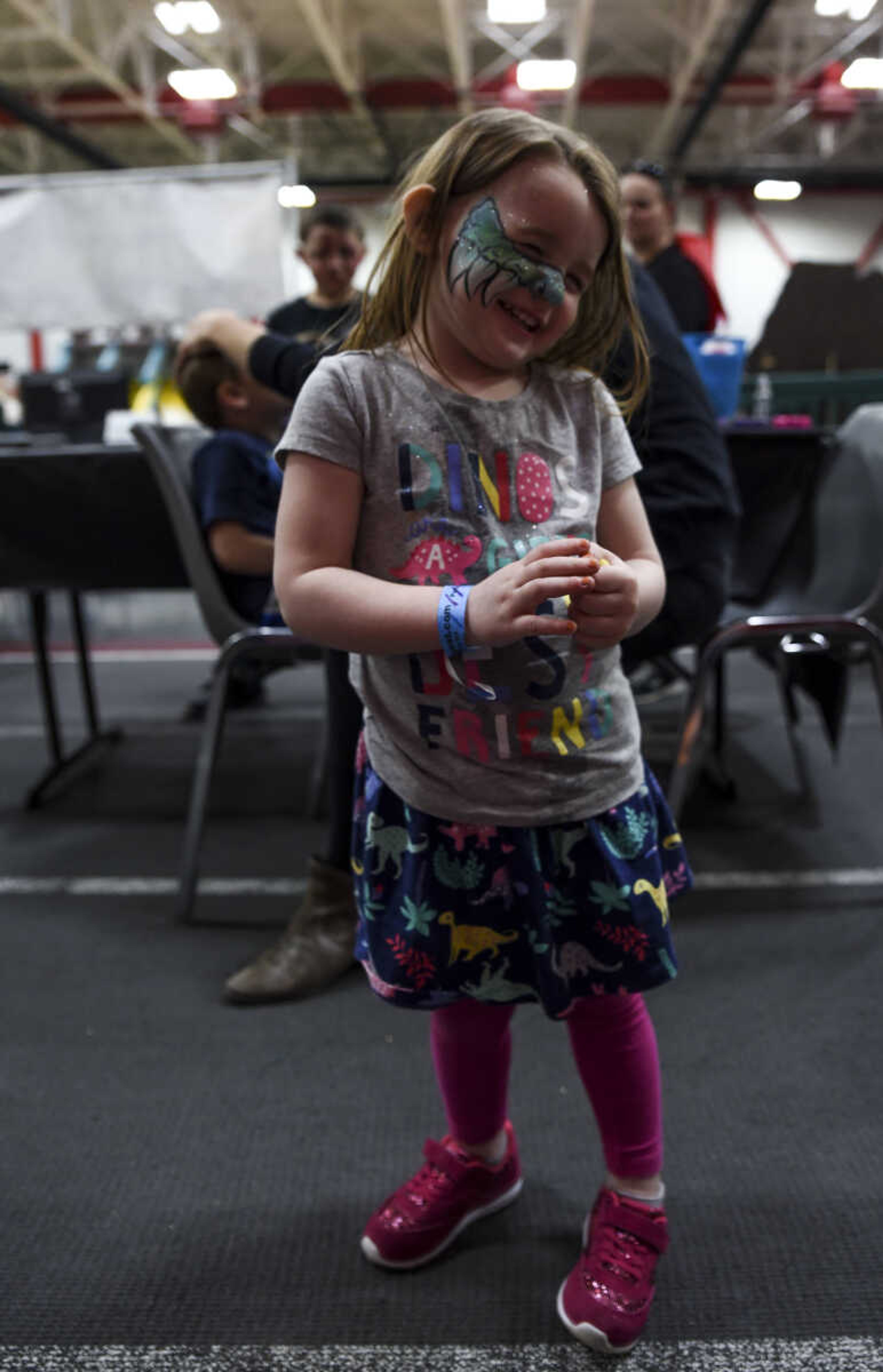 Willa Cisne, 3, poses for a photo at Jurassic Quest Friday, April 27, 2018, at the Show Me Center in Cape Girardeau.