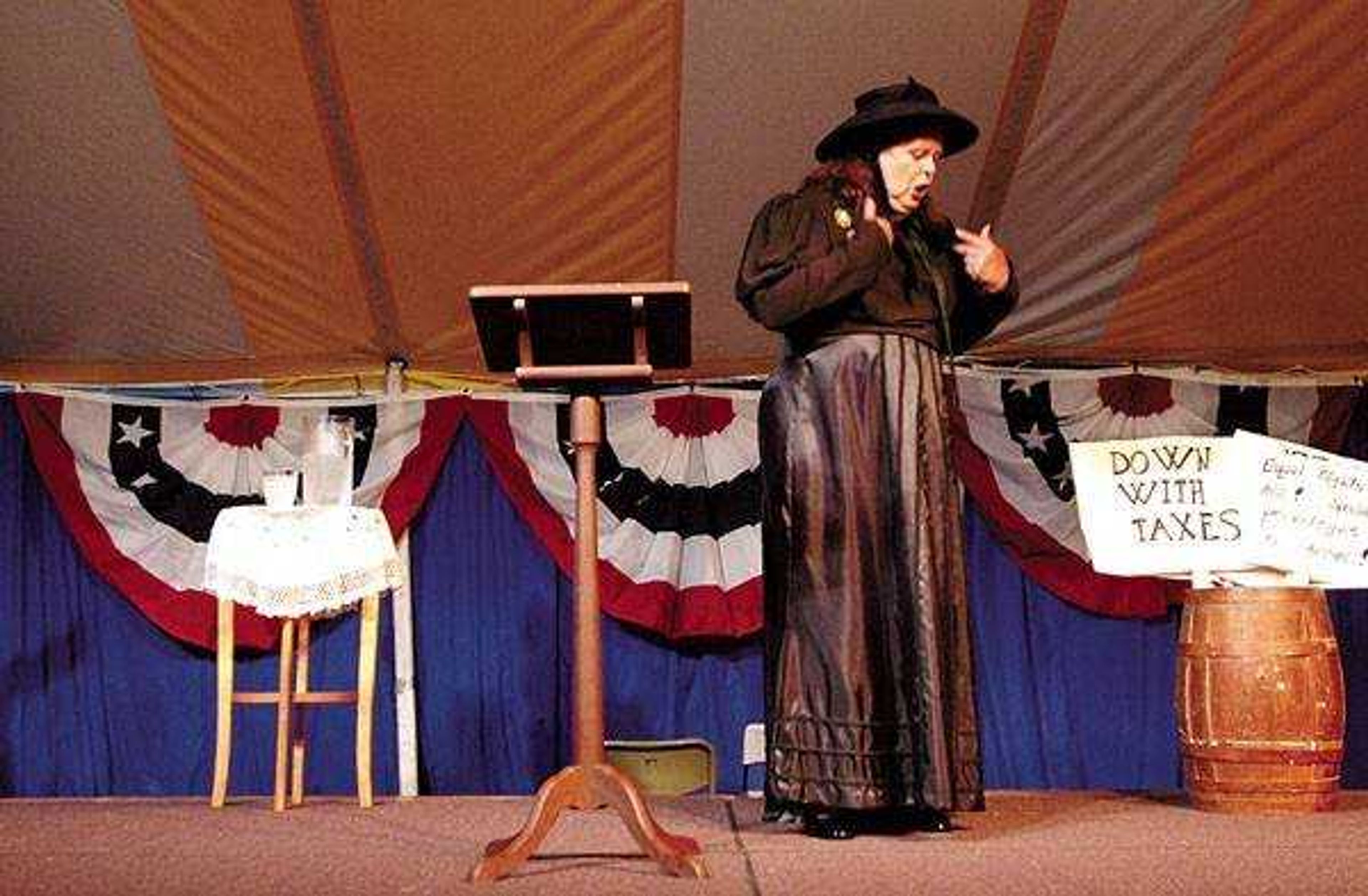 THURSDAY: Mary Elizabeth Lease, portrayed by Glenna J. Wallace, spoke about the problems facing the country in the late 1800s. "We need change!" she repeated, to which the audience responded by throwing their spare change onto the stage.