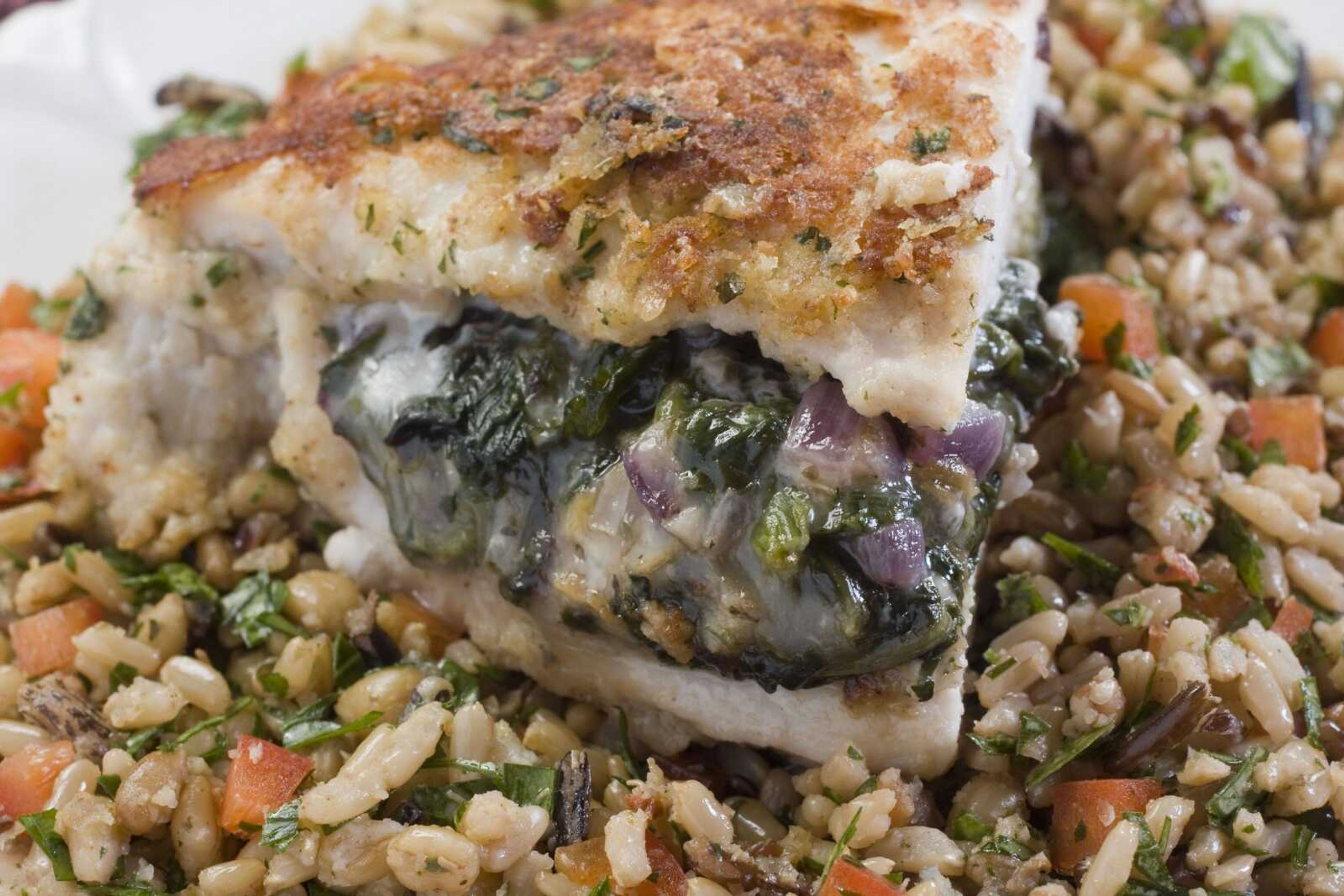 A blend of reduced-fat cheese and an intensely flavored Gorgonzola helps make this chicken stuffed with cheddar, Gorgonzola and spinach both healthy and flavorful. (Larry Crowe ~ Associated Press)