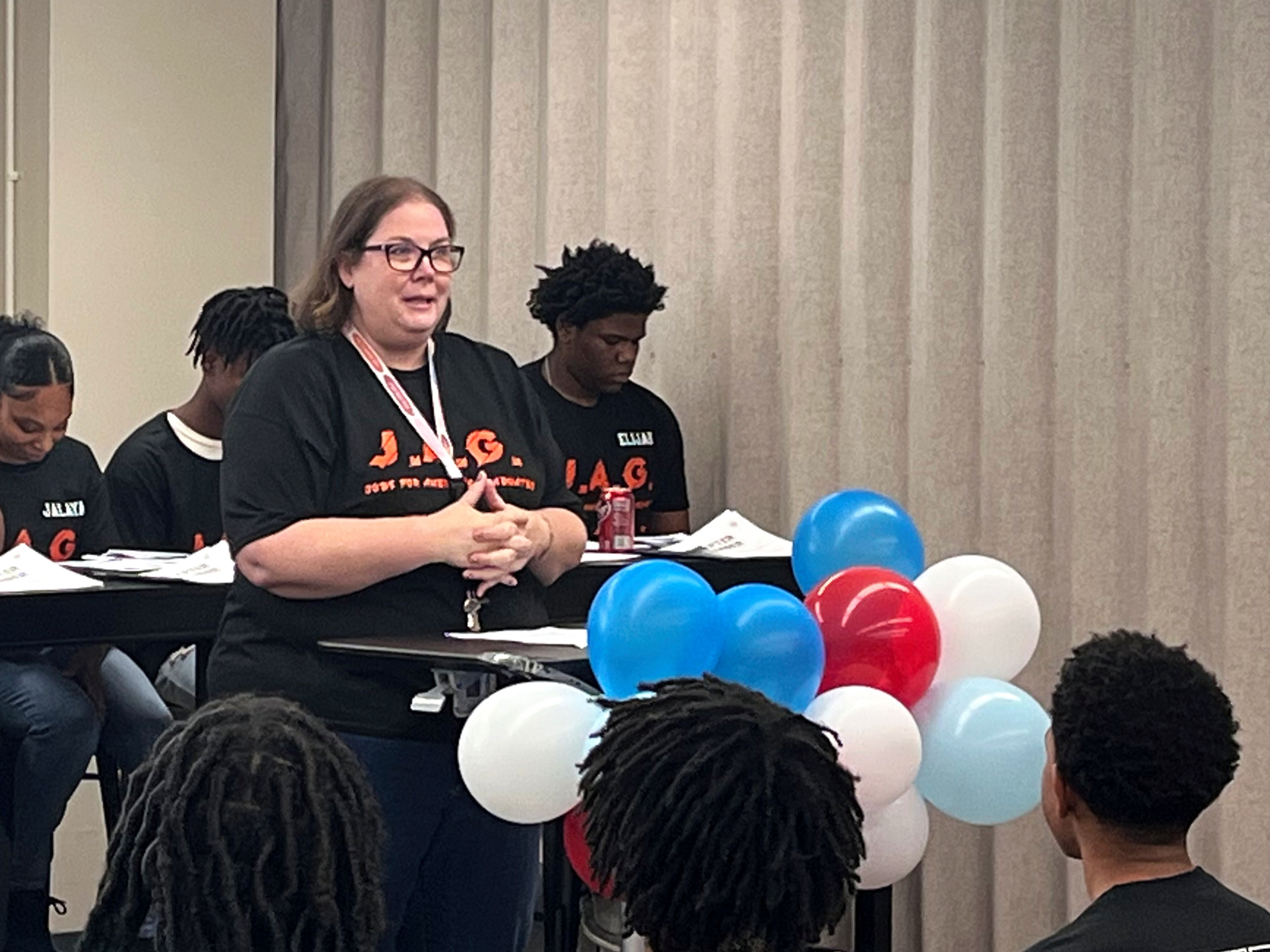 Cape Girardeau Central Academy's JAG specialist Nichole Buehrle provides opening remarks during the program's installment ceremony Wednesday, Oct. 2, at Cape Girardeau Public Schools' Central Administrative Offices.