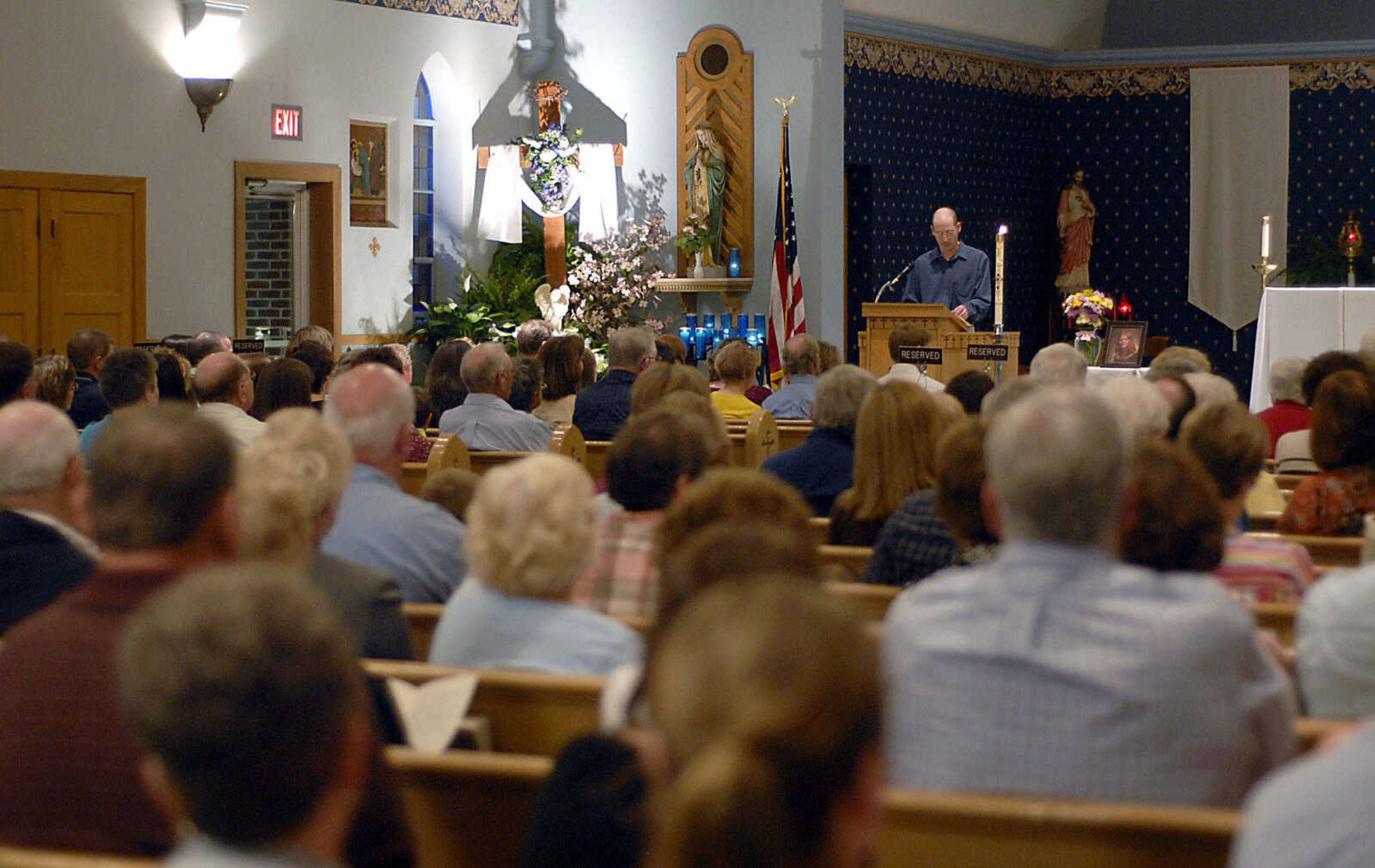 KIT DOYLE ~ kdoyle@semissourian.com
Jeff Scherer speaks at a prayer service for his cousin Cheryl Scherer Friday, April 17, 2009, at St. Denis Church in Benton.