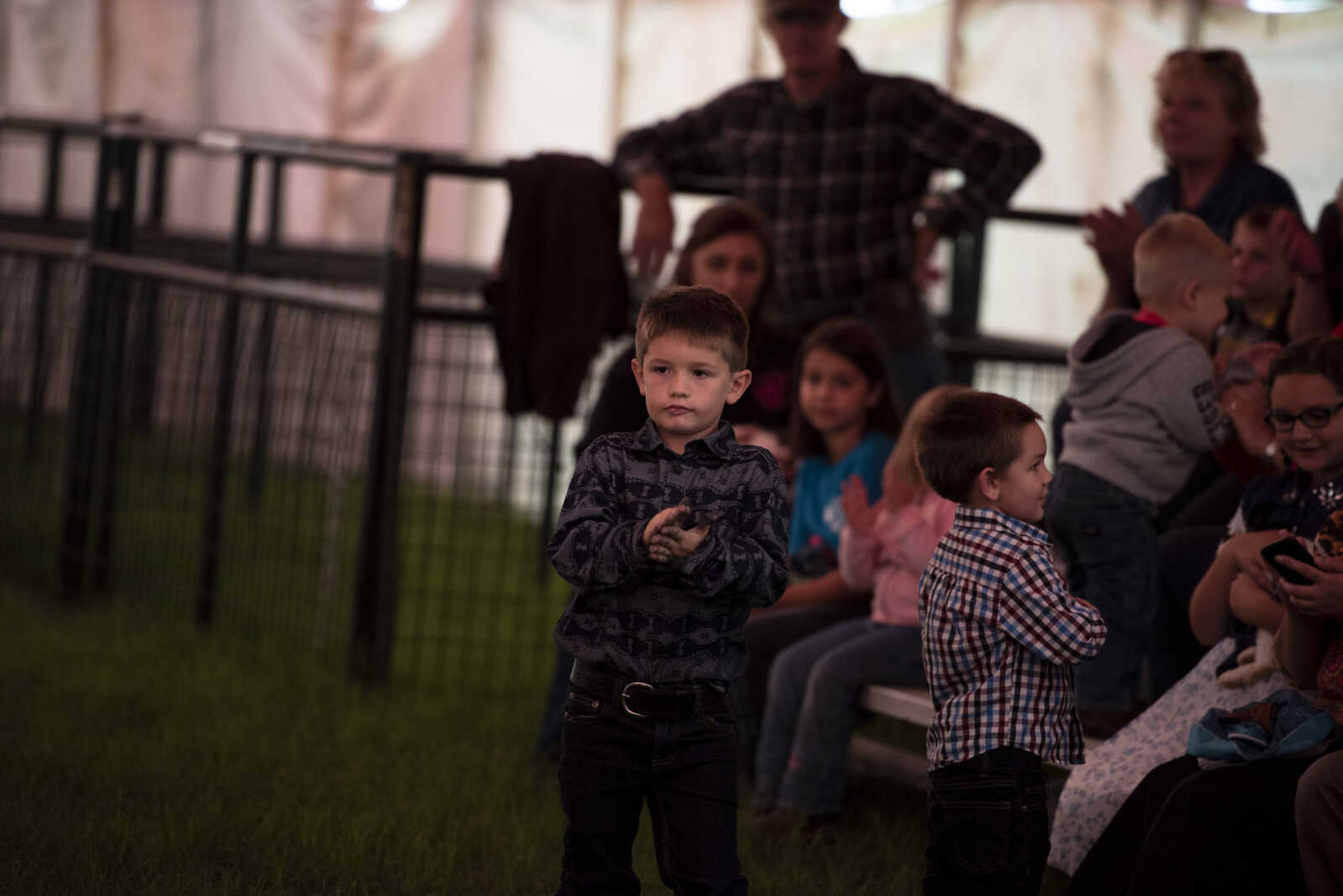 Elijah Standley, 6, claps during the Poultry and Rabbit Dress-Up Contest at the SEMO District Fair Sunday, Sept. 9, 2018 in Cape Girardeau.